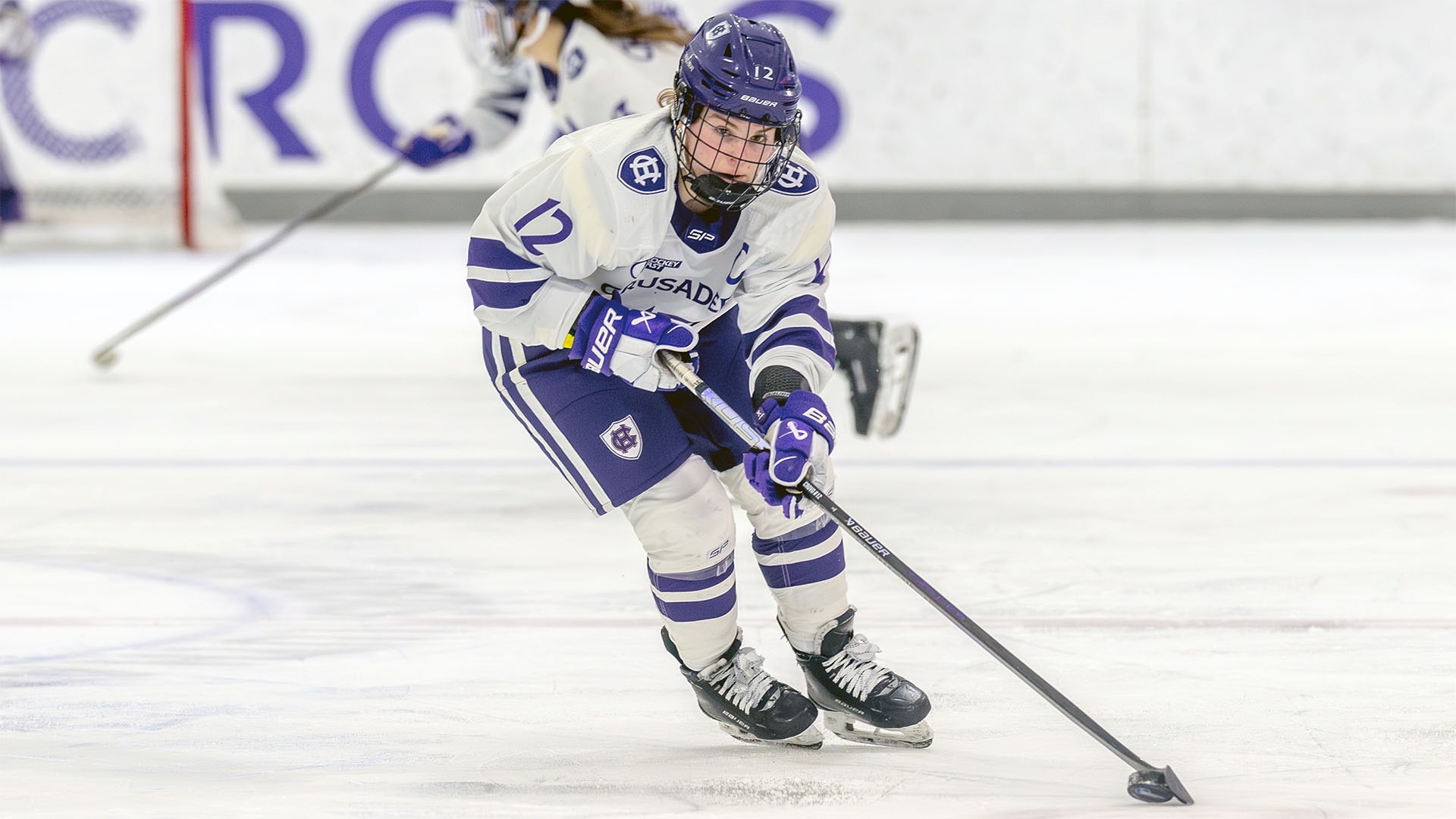 Emily Crovo with the puck against Vermont