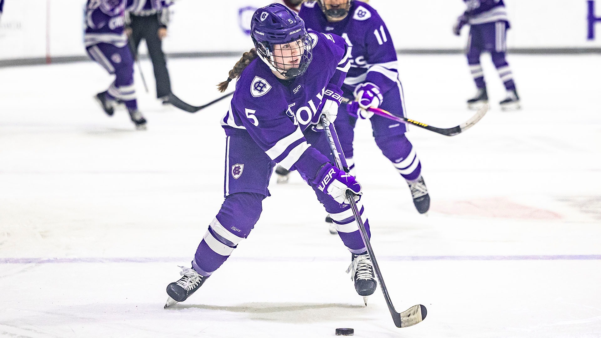 Violet Carroll with the puck against Boston College