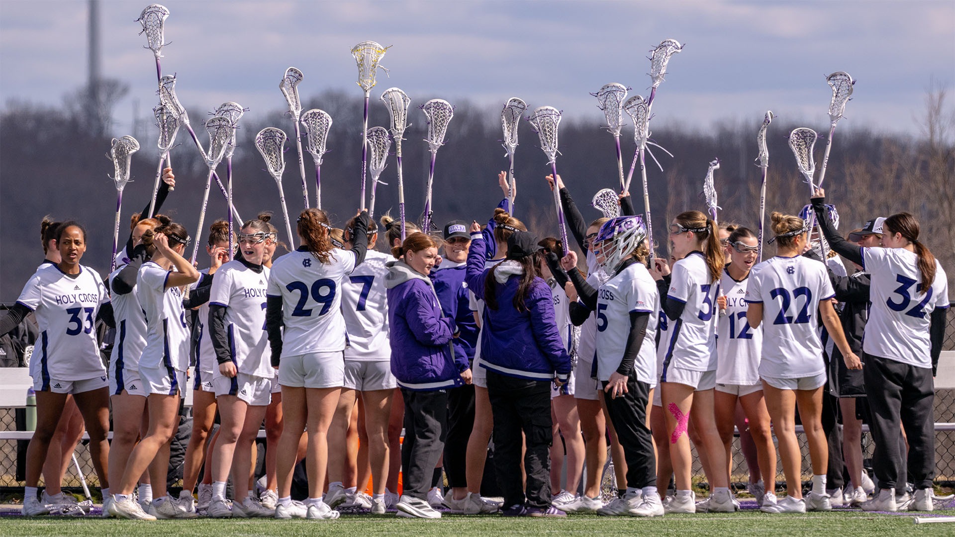 Holy Cross huddles during its game against Navy