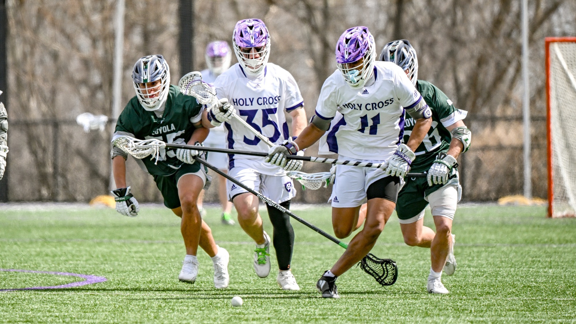 Julian Jenkins chases a ground ball against Loyola