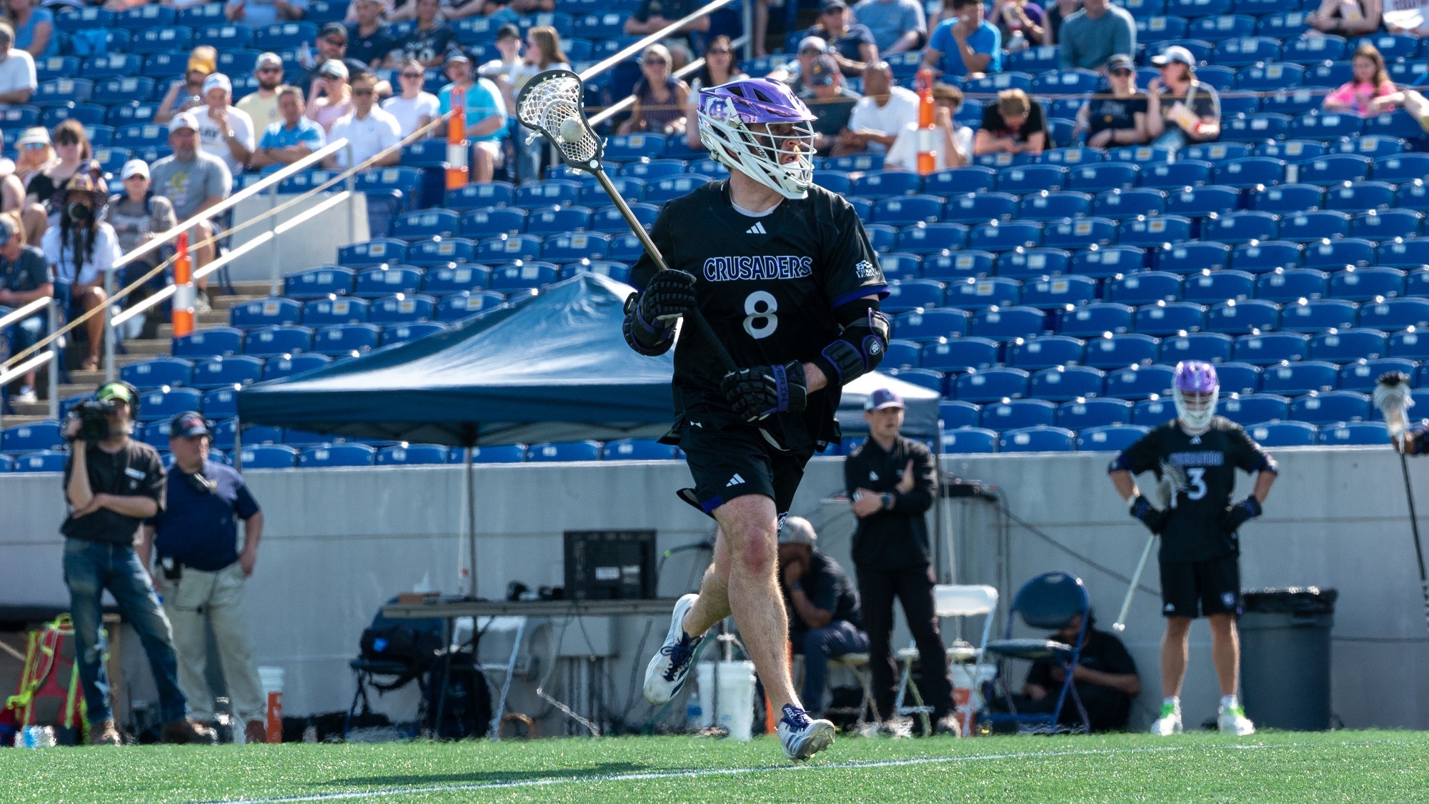 Ryan Botek runs with the ball at Navy