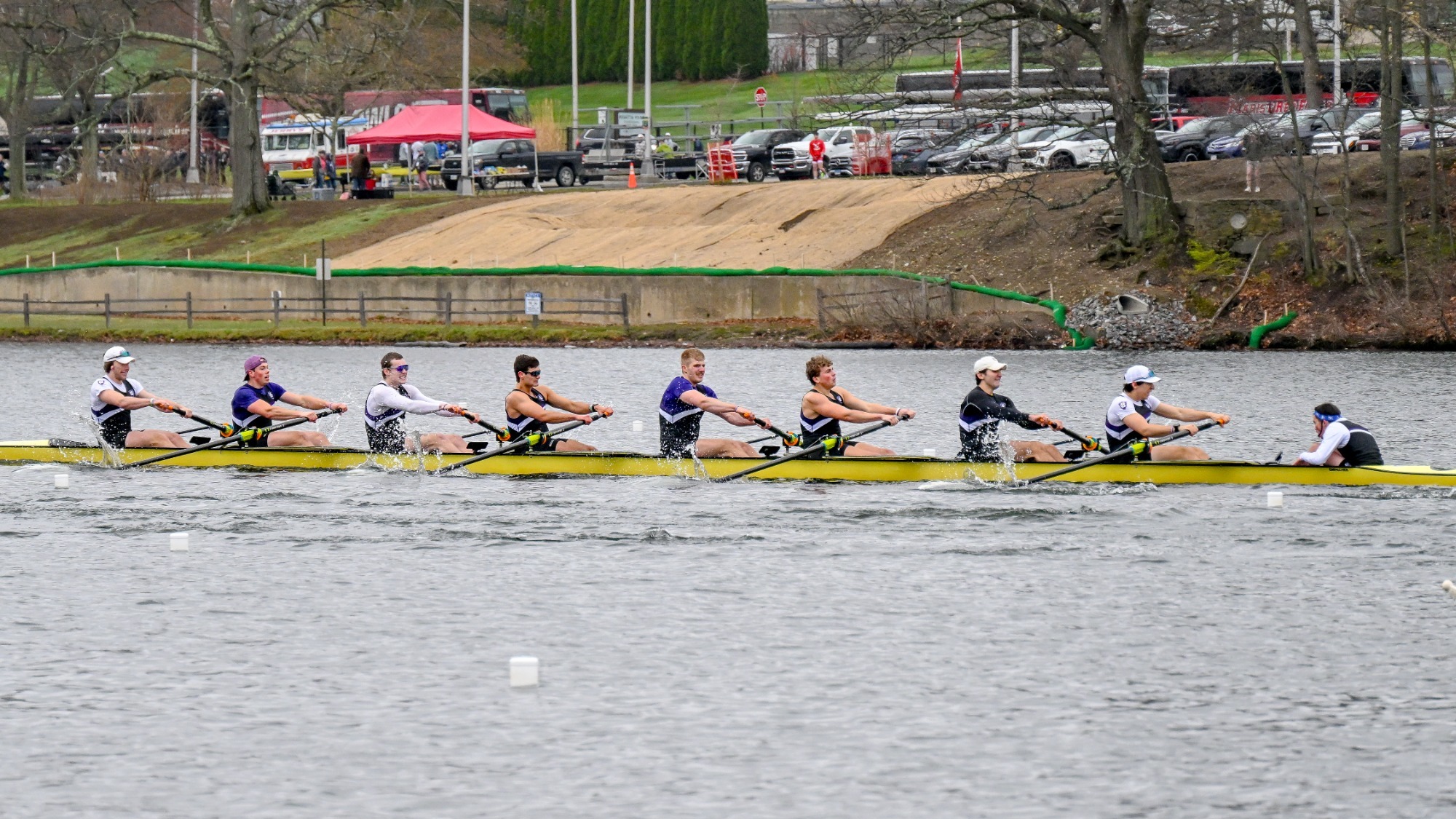 The men's rowing varsity 8+ competes at Lake Quinsigamond