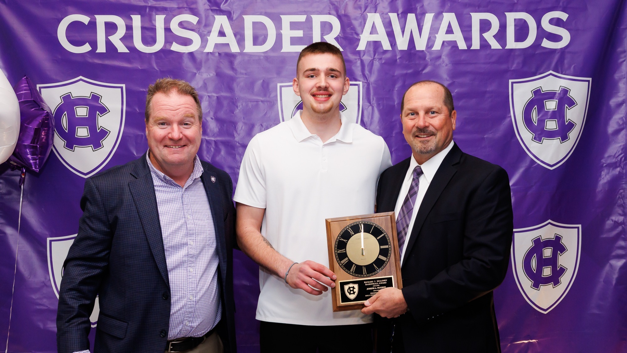Joe Nugent receiving the Maloney Award from head coach Dave Paulsen and Gordie Lockbaum of the Varsity Club