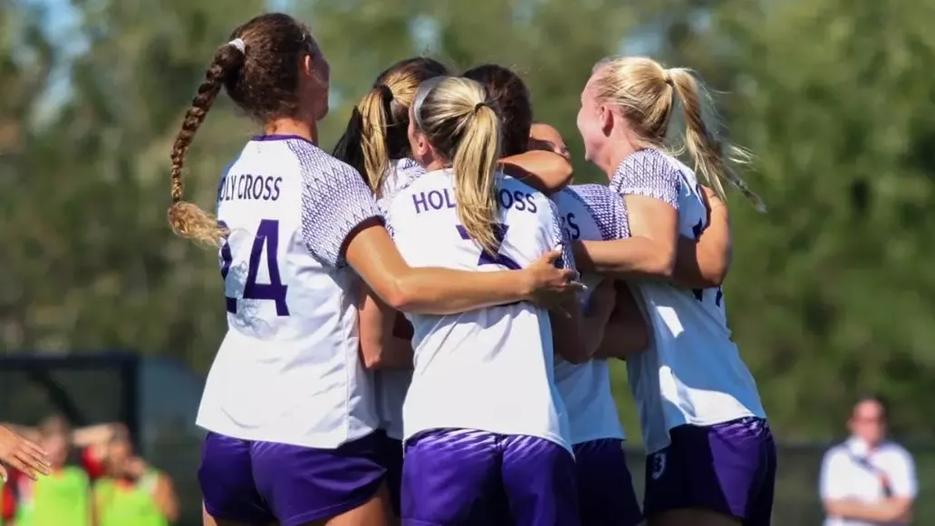 Women's Soccer Team huddle 2025