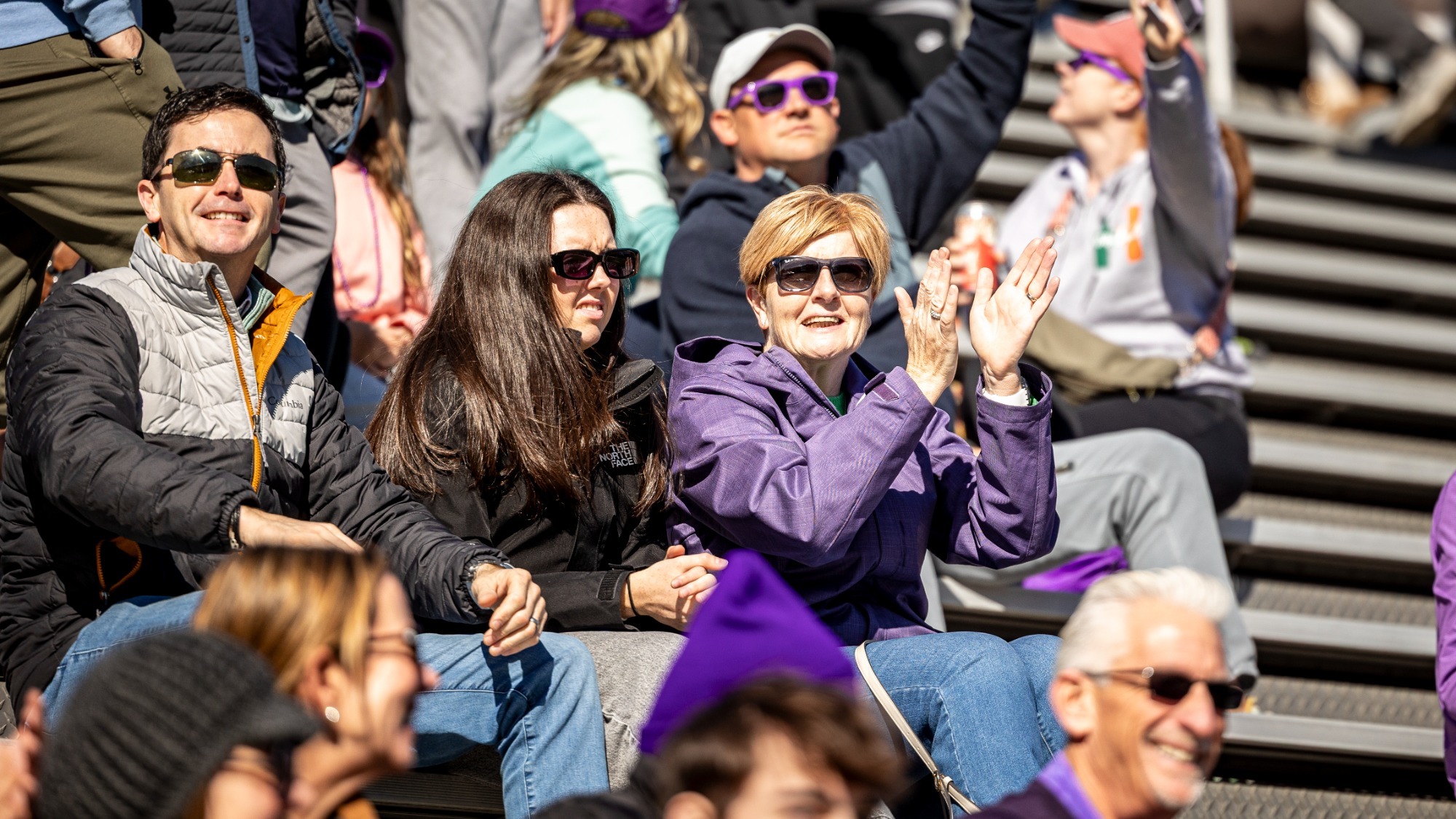 Fans cheering at football game