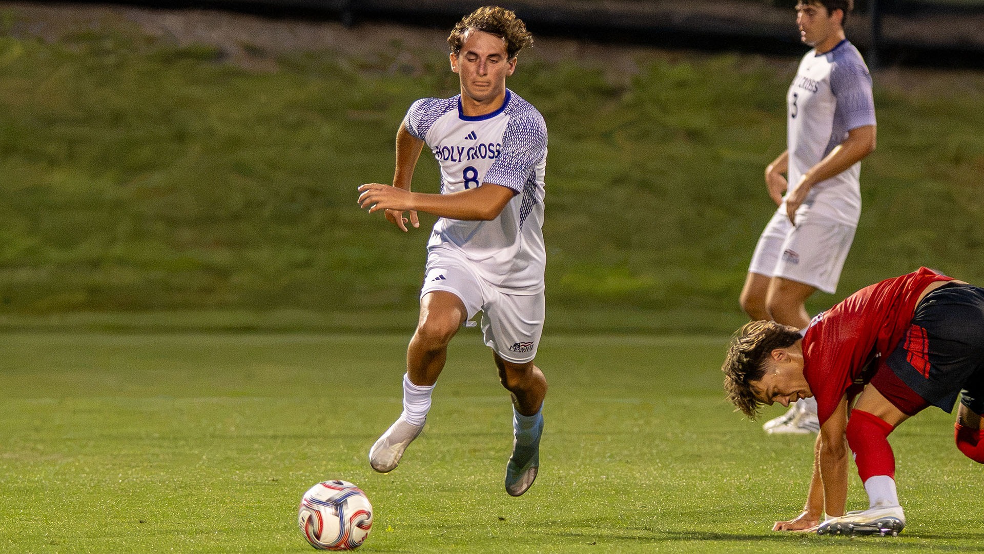 Griffin Collins with the ball against Northeastern