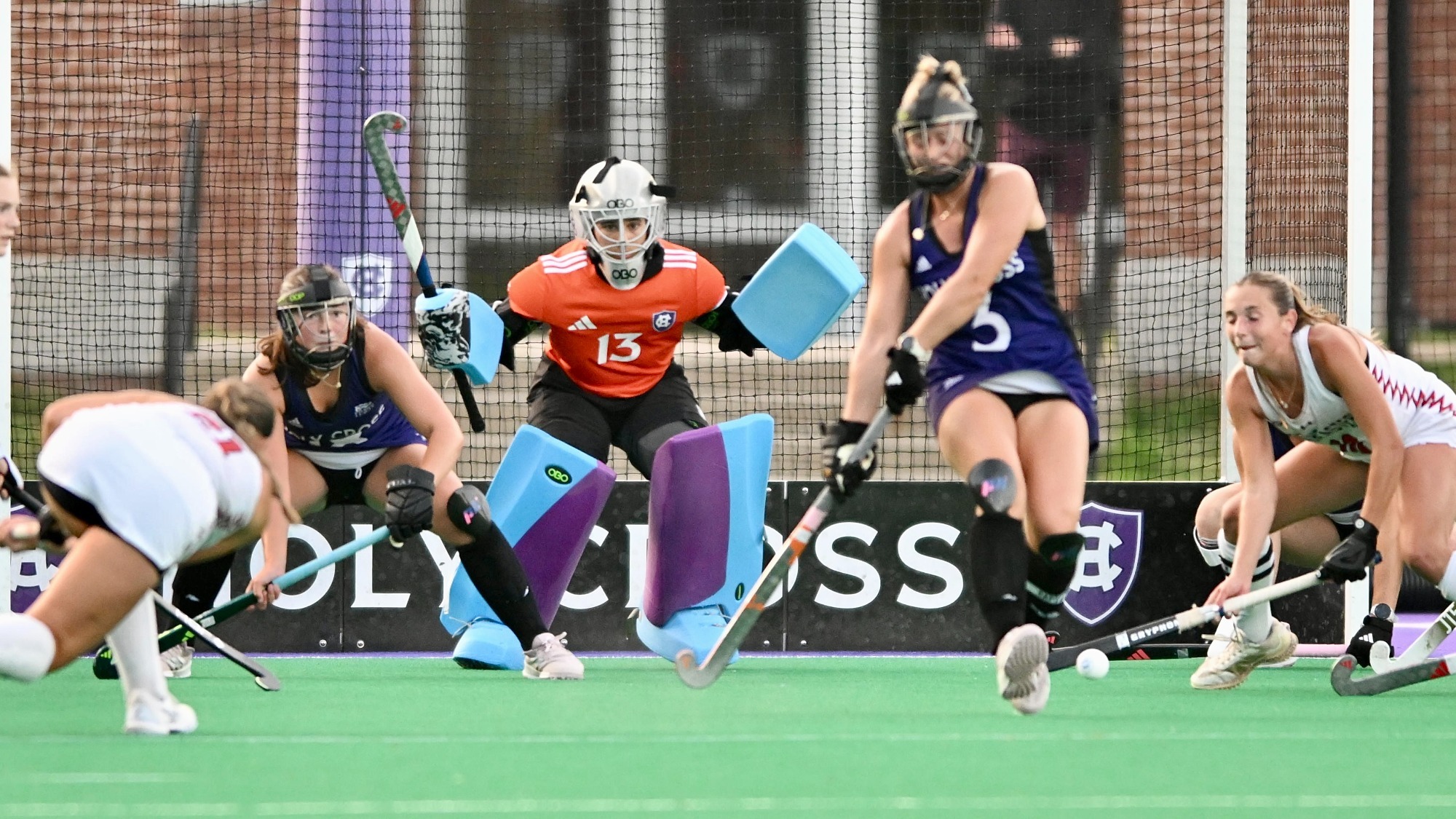 Mia McCloskey defends a shot by Northeastern