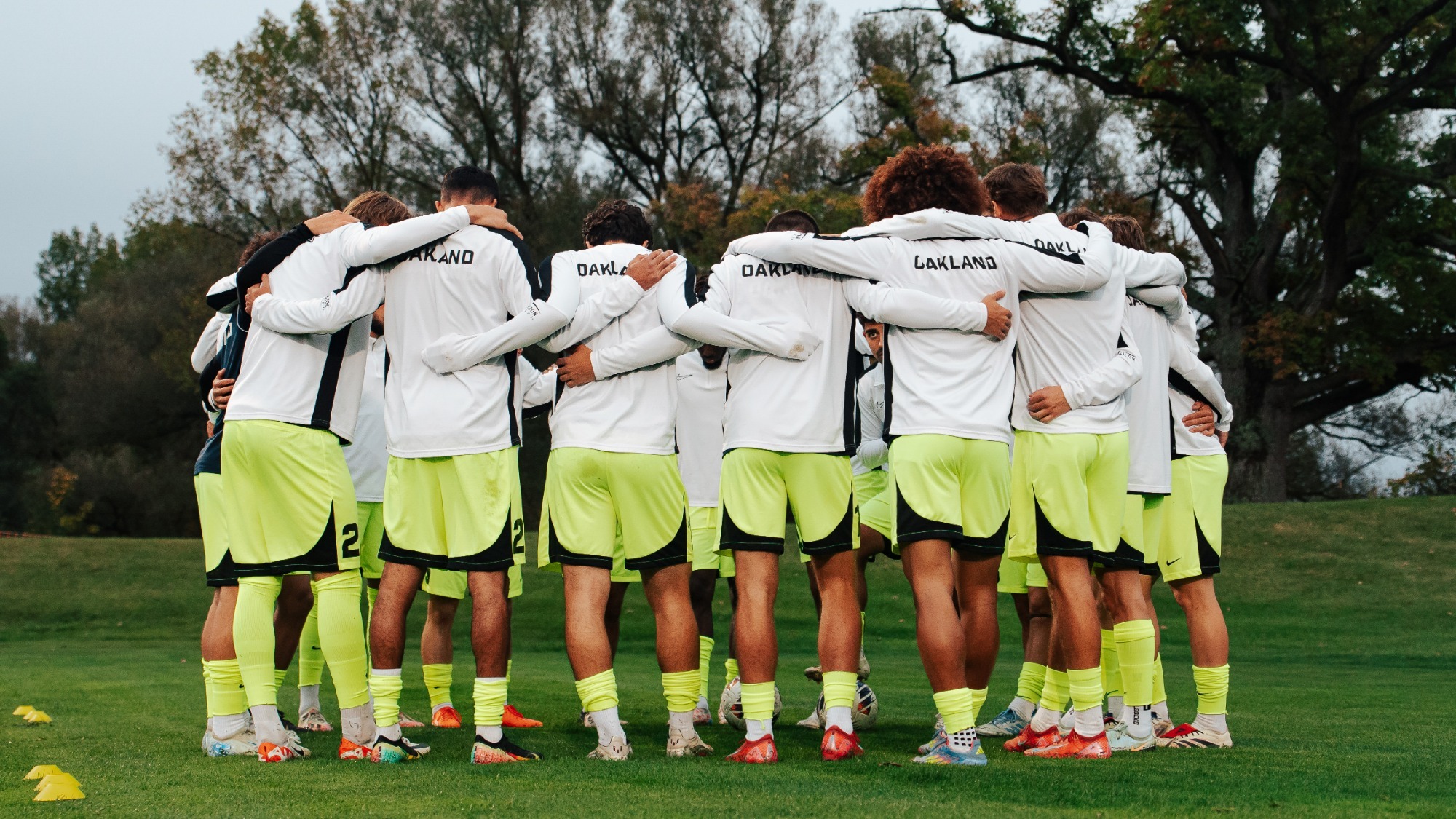 men's soccer neon huddle