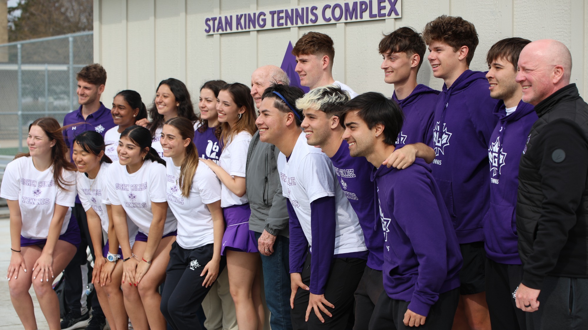 Tennis teams and Stan King pose at Stan King Tennis Complex