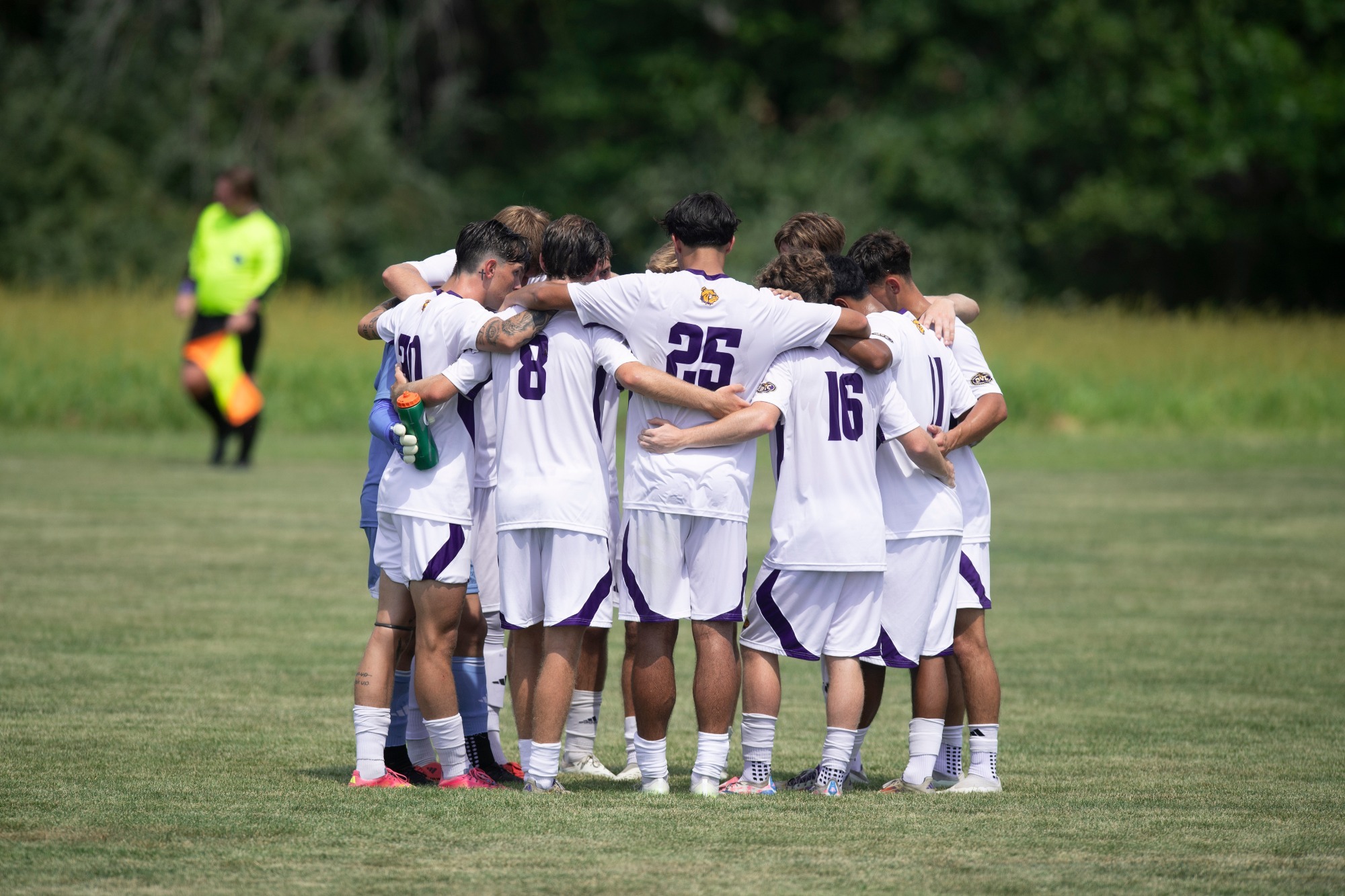 MEN'S SOCCER GROUP HUDDLE