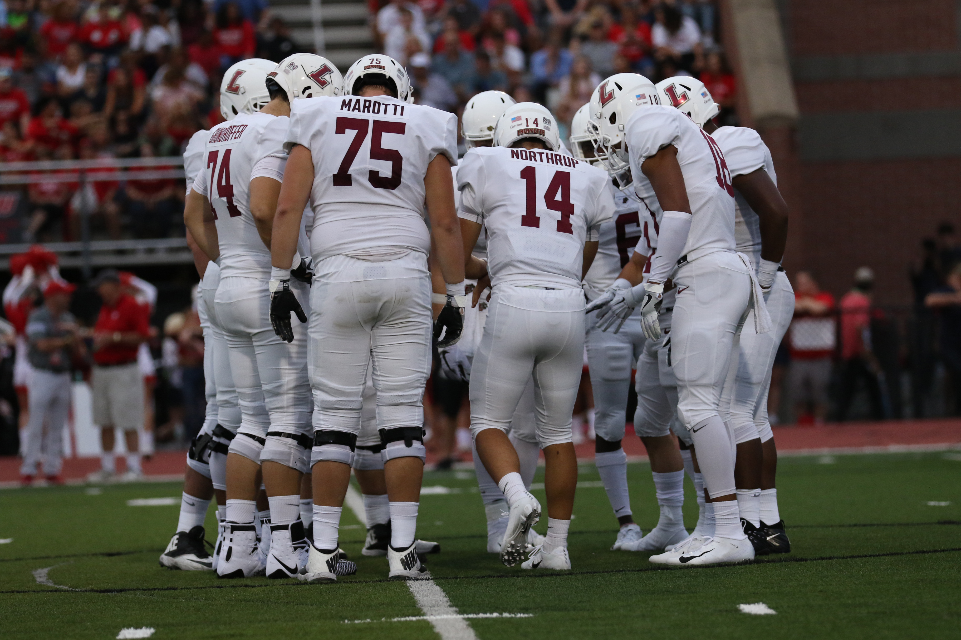 Offensive line huddle