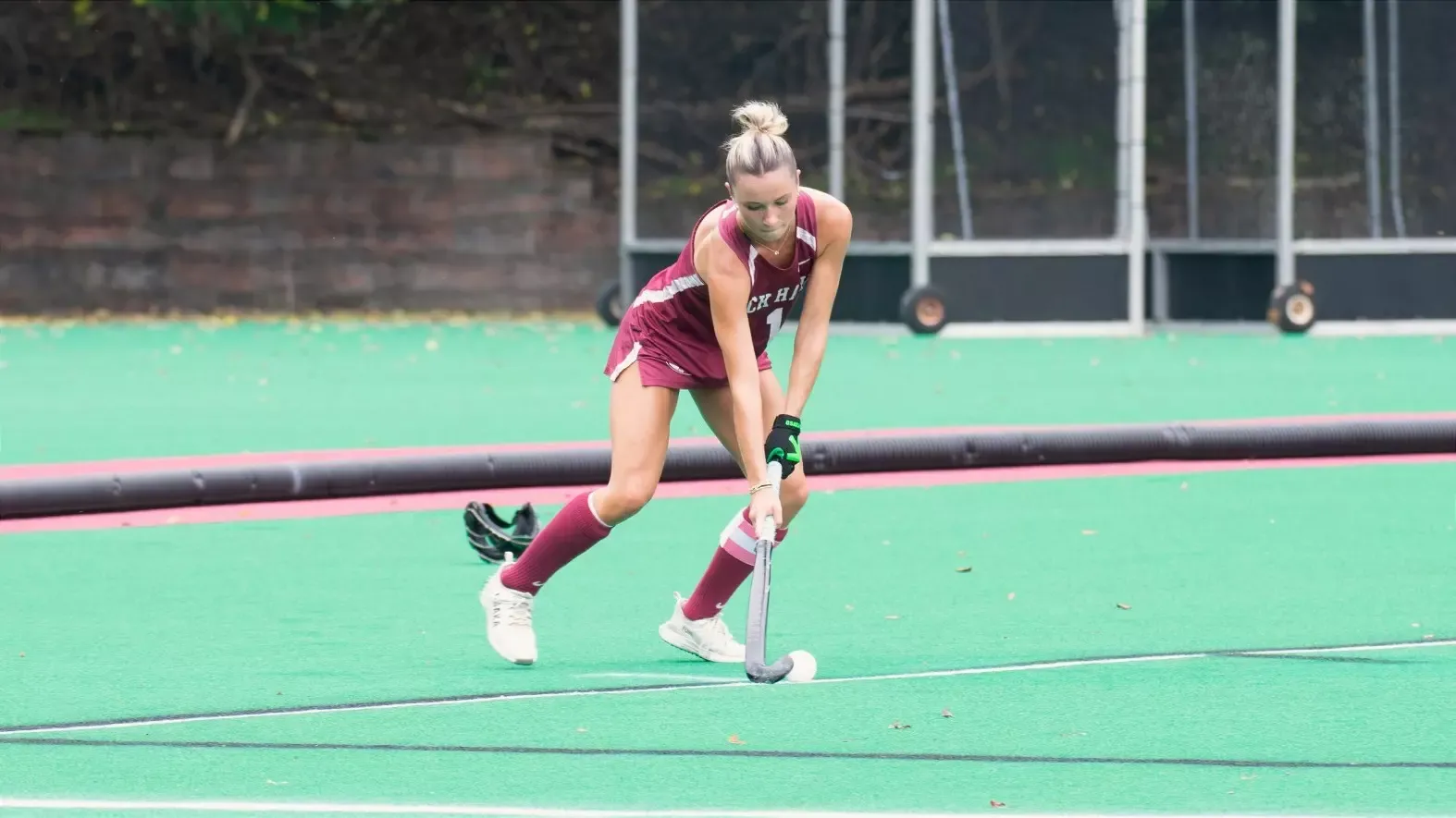 Field Hockey player Maddy Friend dribbles