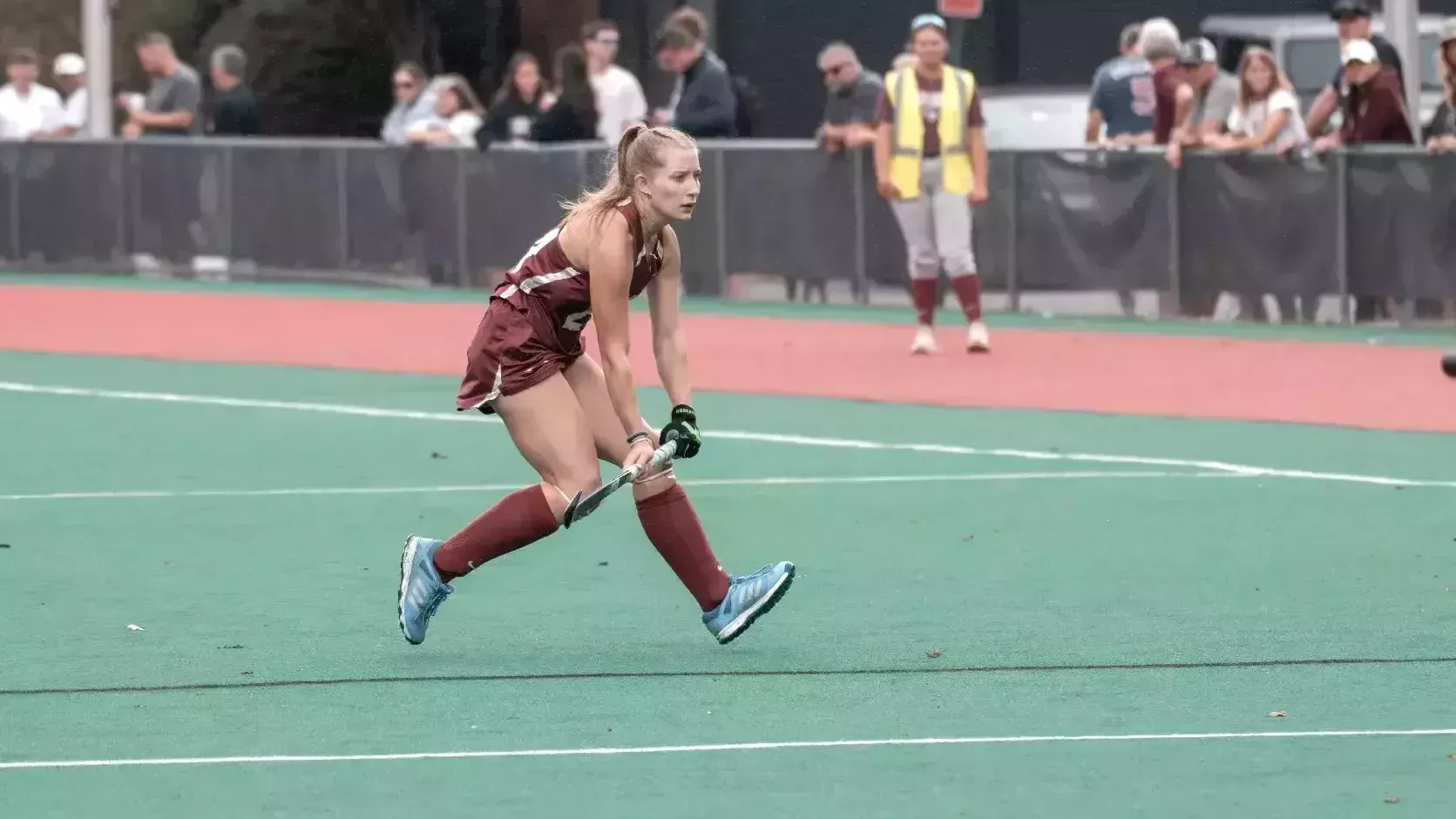 Melanie Beall at midfield in field hockey action