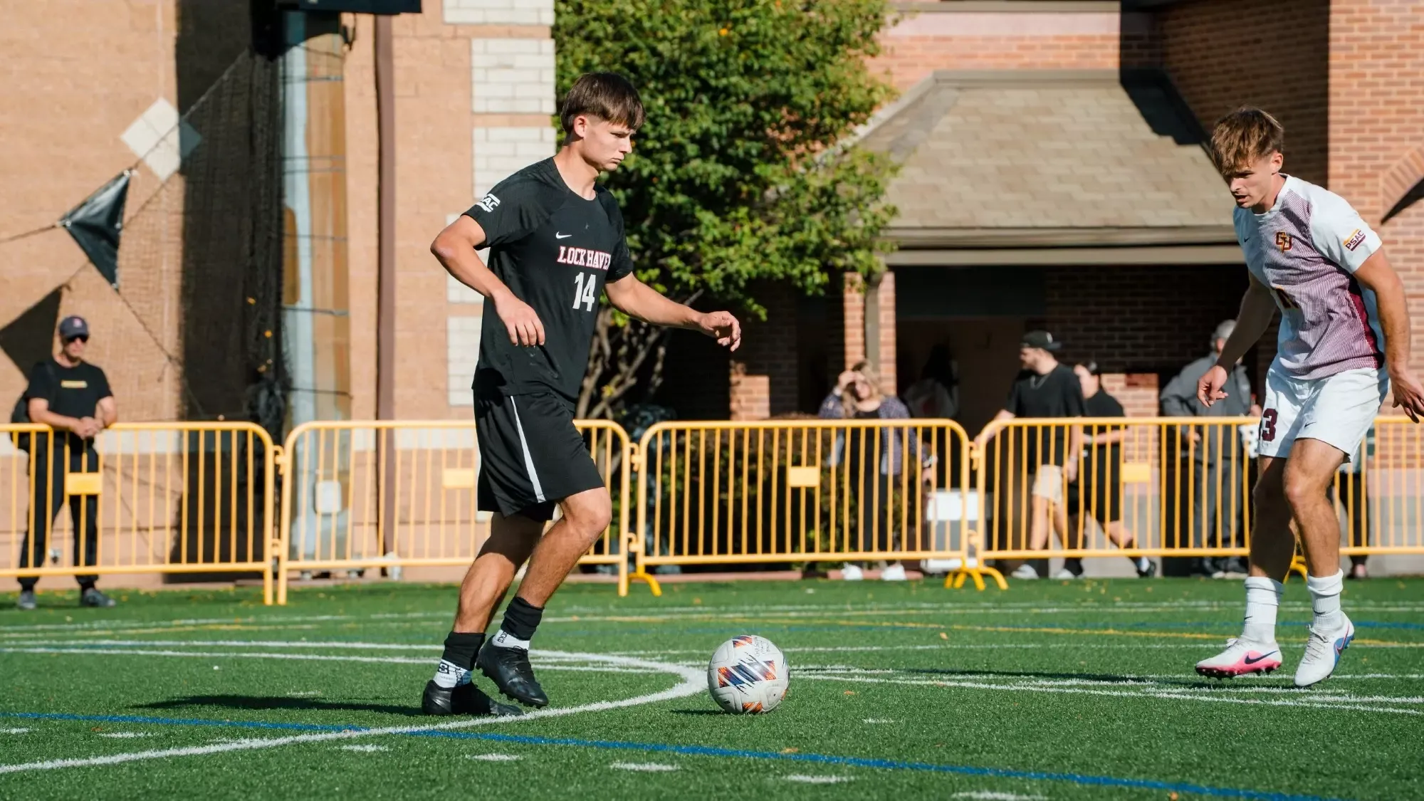 Scott Manning possesses in men's soccer action 