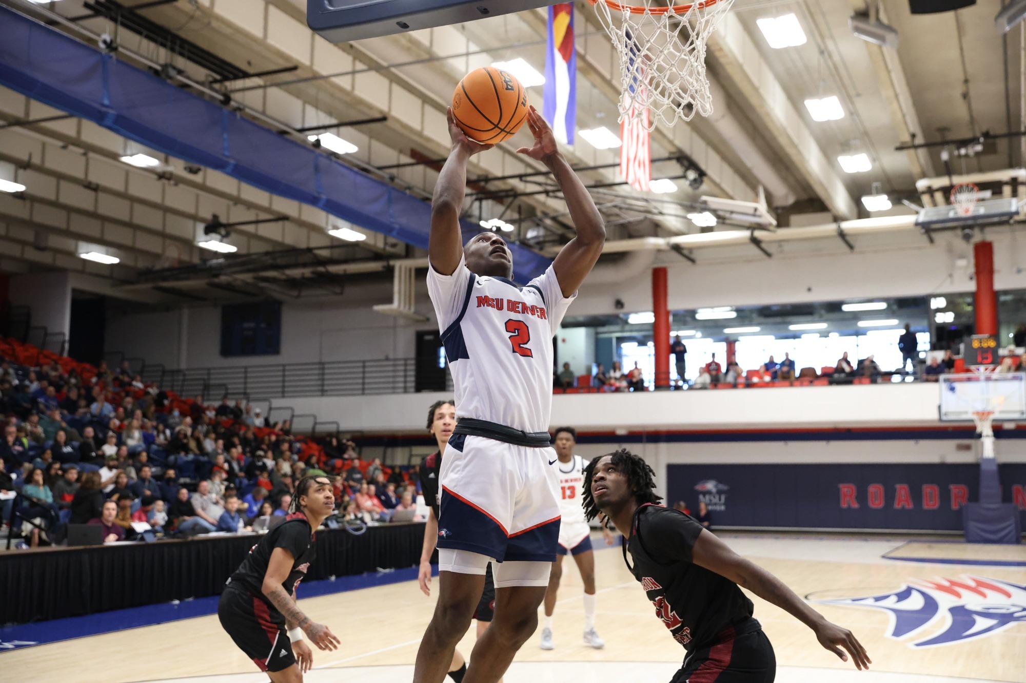 MSU Denver men's basketball player Quave Propst-Allison going up for a shot in a basketball game.