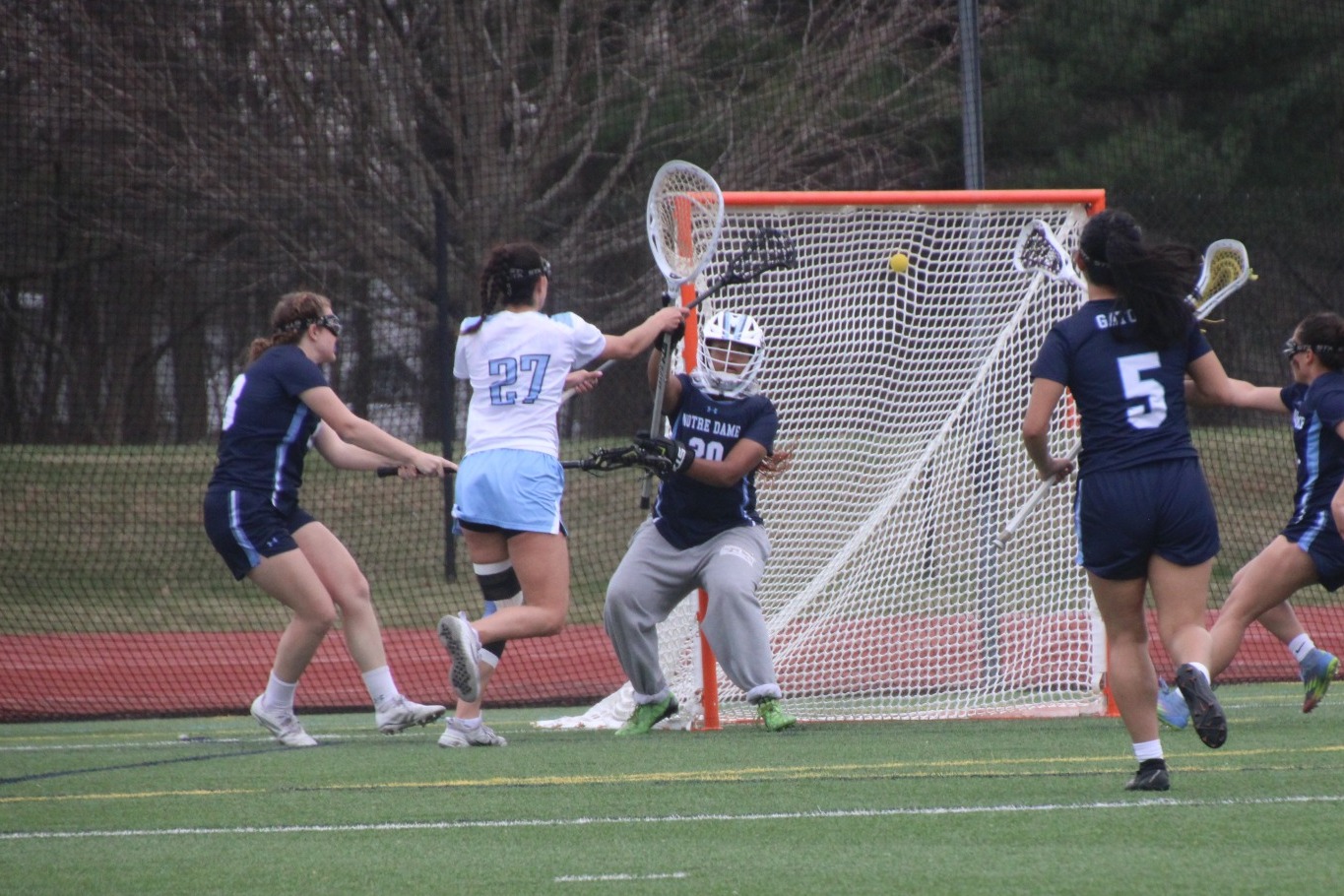 IUWLax Alexa Marczak scores  against NDM