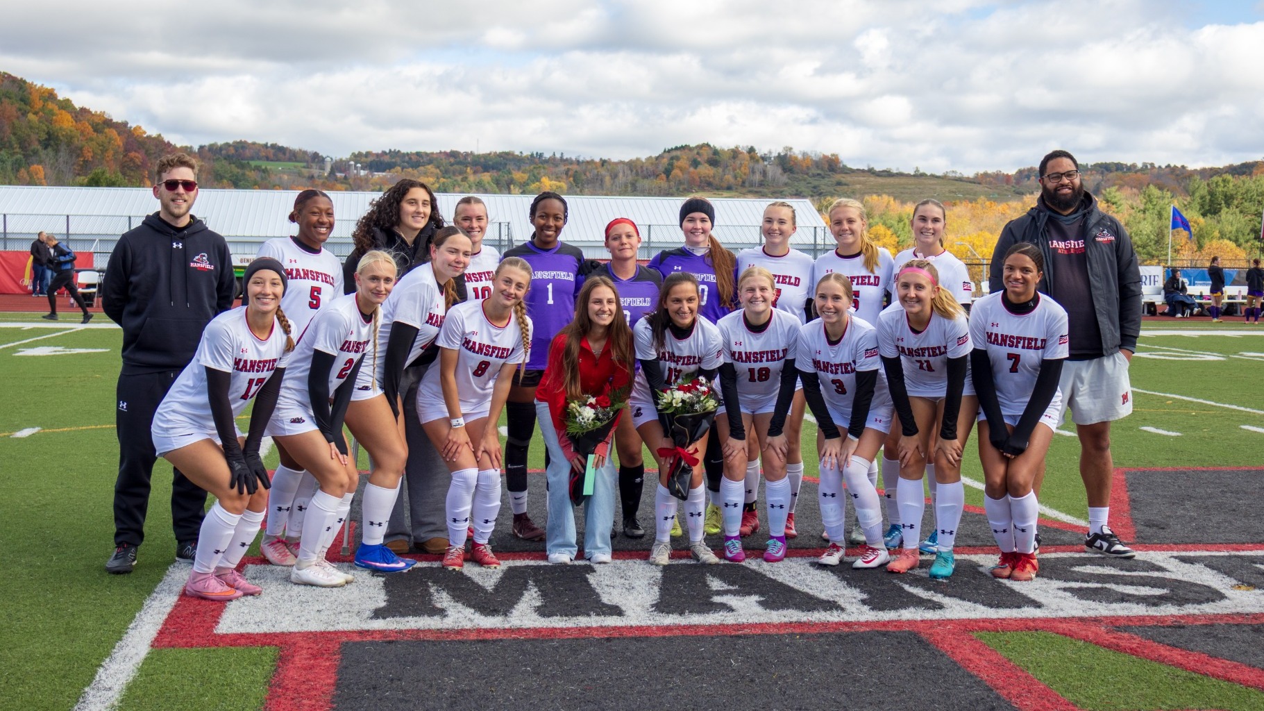 Team pose for senior day