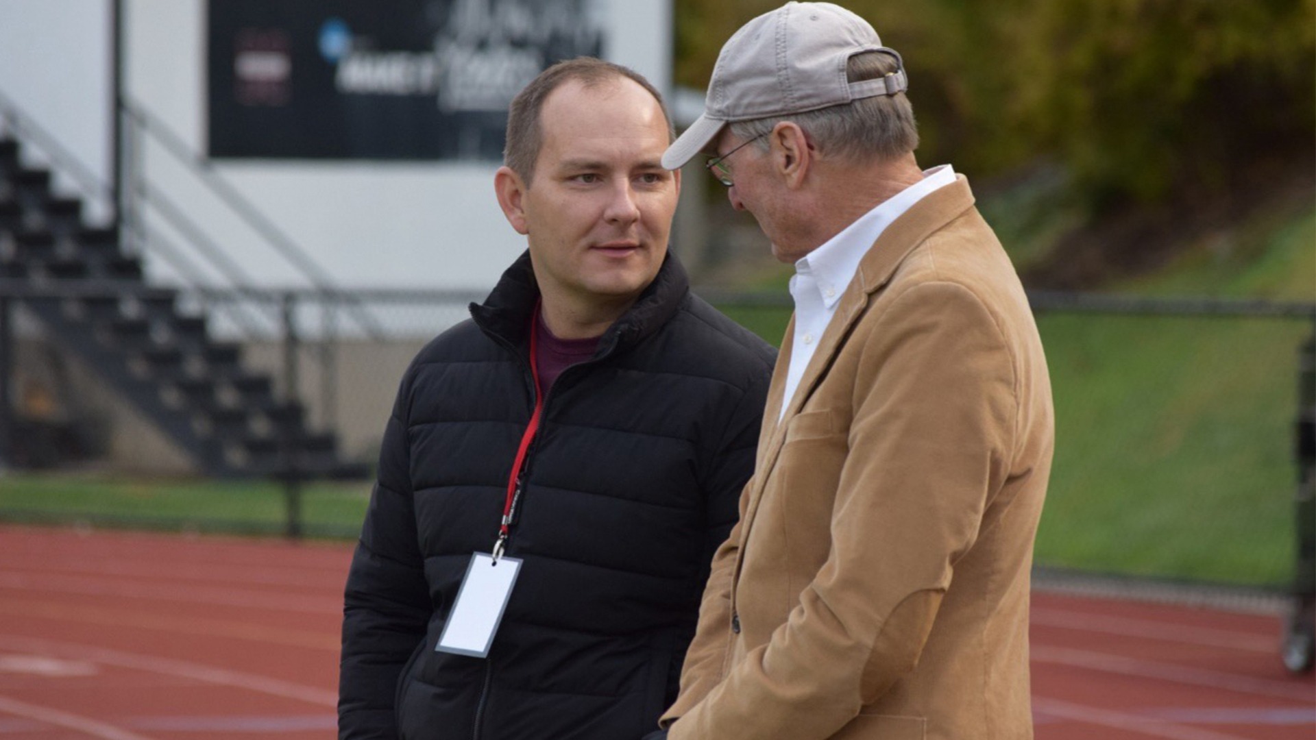Mansfield Athletic Director Andrew Petko speaks with Steve McCloskey during an athletic event at Van Norman Field