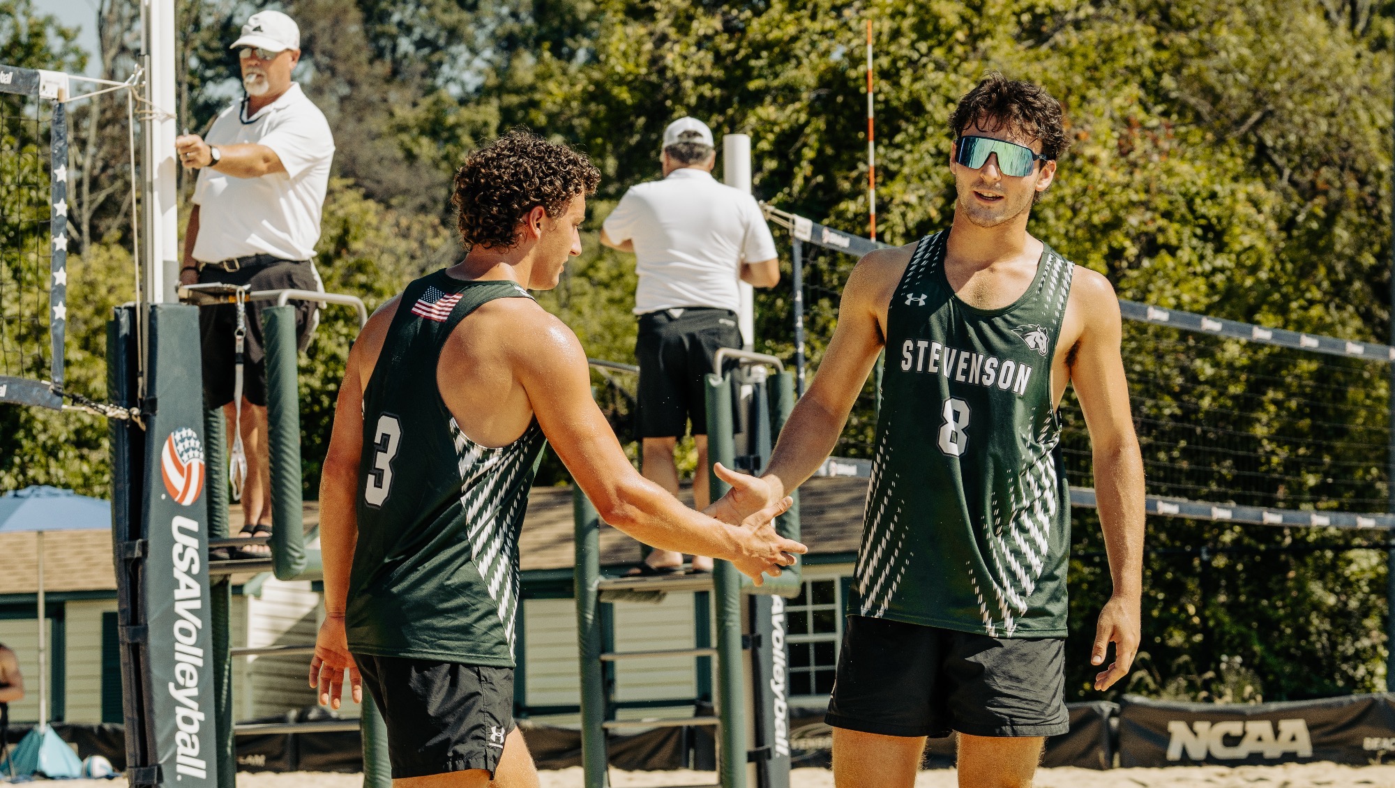 J. Sledz and Bones celebrate after point