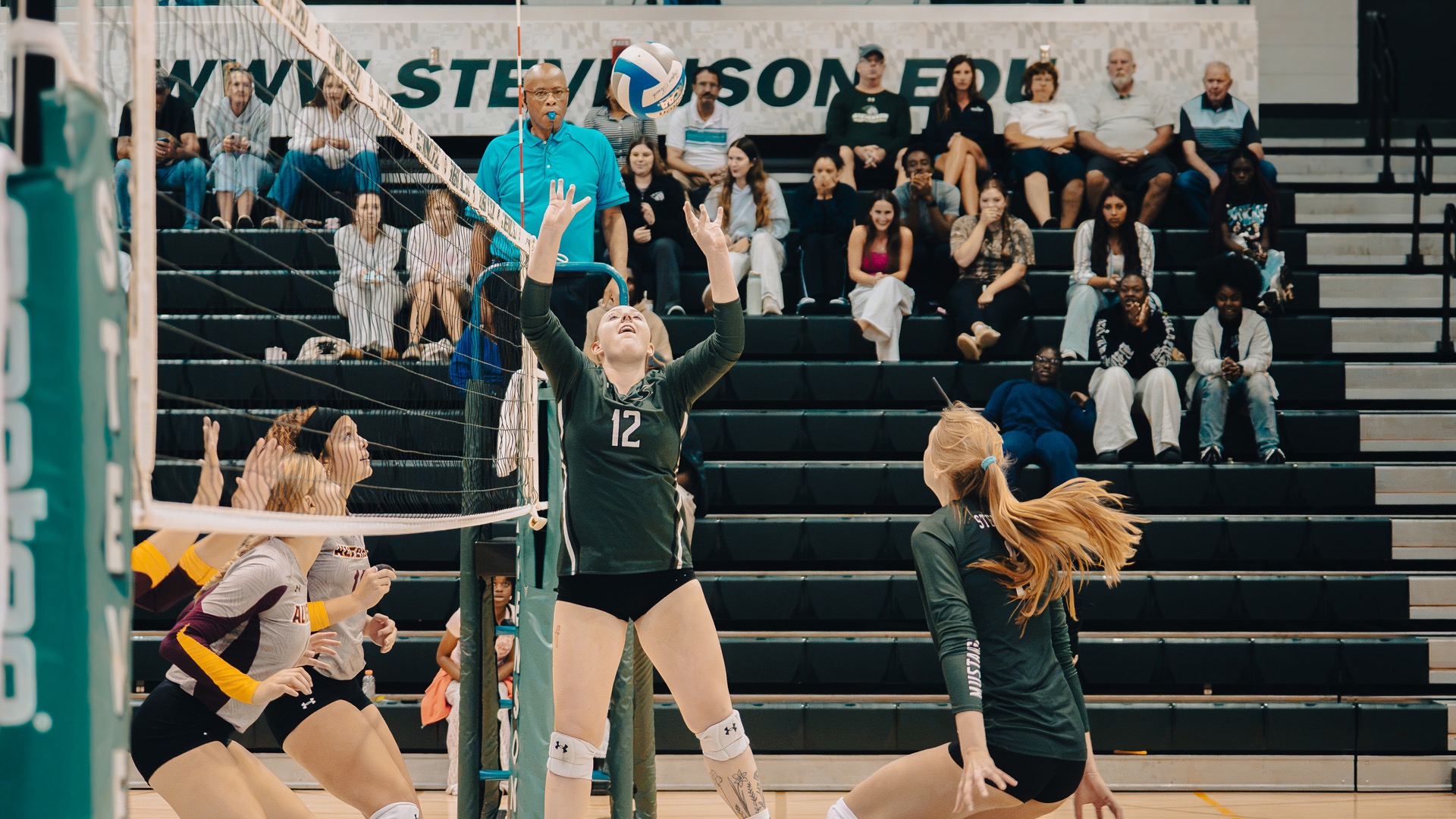 Tooze Seetting up her teammate at the top of the net