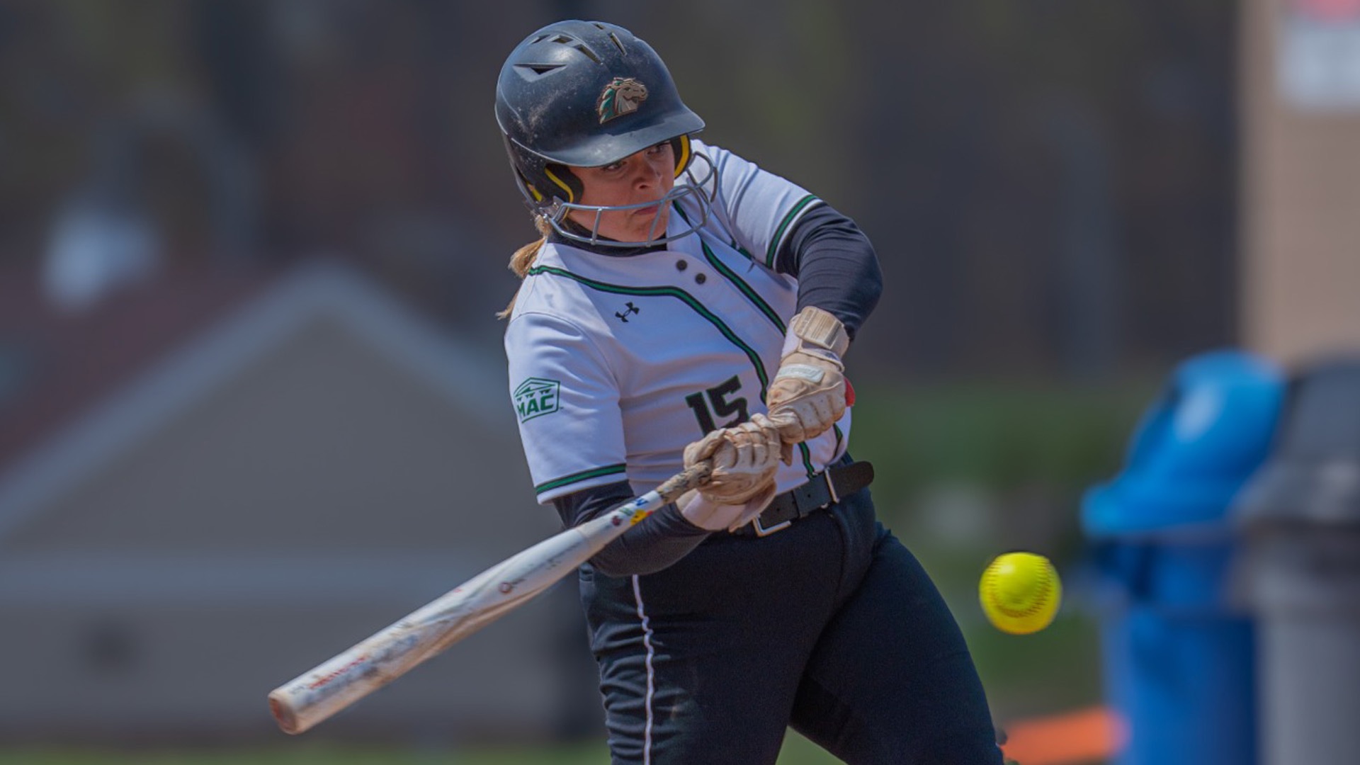 Caylee Cliett looking and taking a swing at the ball