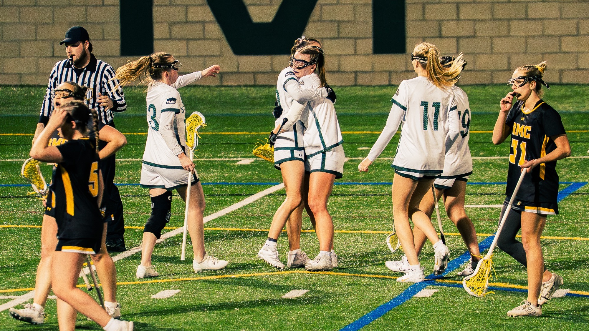 Stevenson Women's Lacrosse players celebrating after goal.