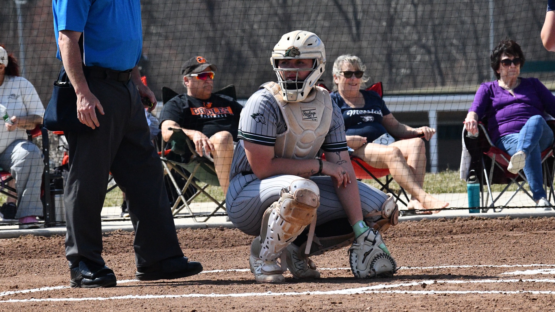 Emily Hamp in the catcher position, looking for the call from coach