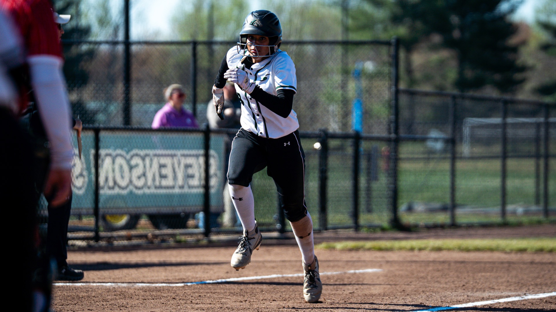 Olivia Munoz running to home base to score