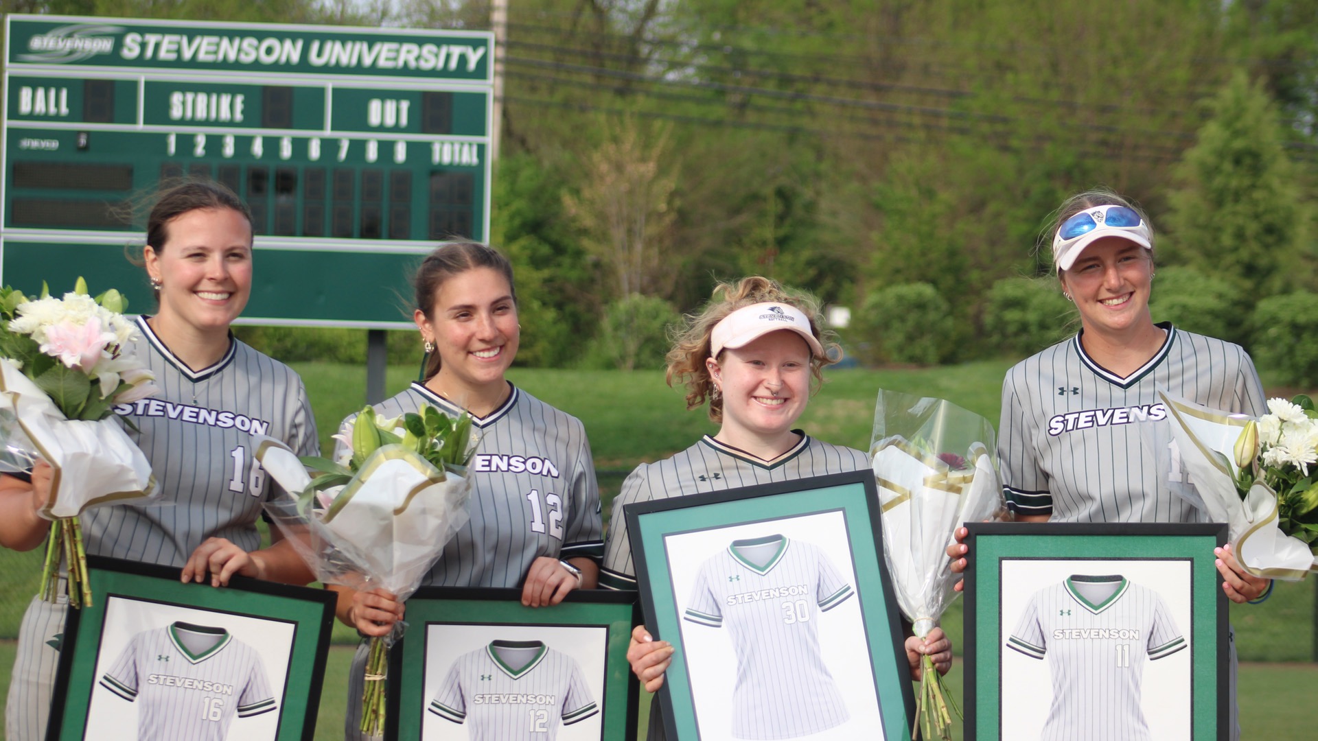 2026 Softball Seniors possing together