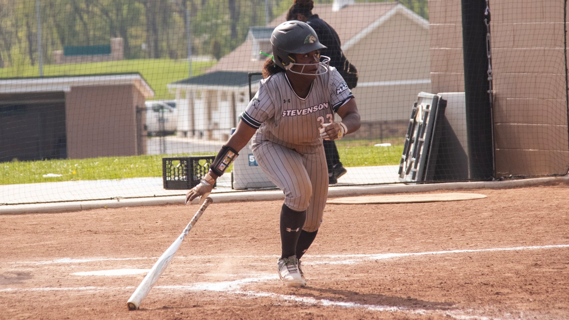 Sahara Ward looking towards the field as her hit travels out