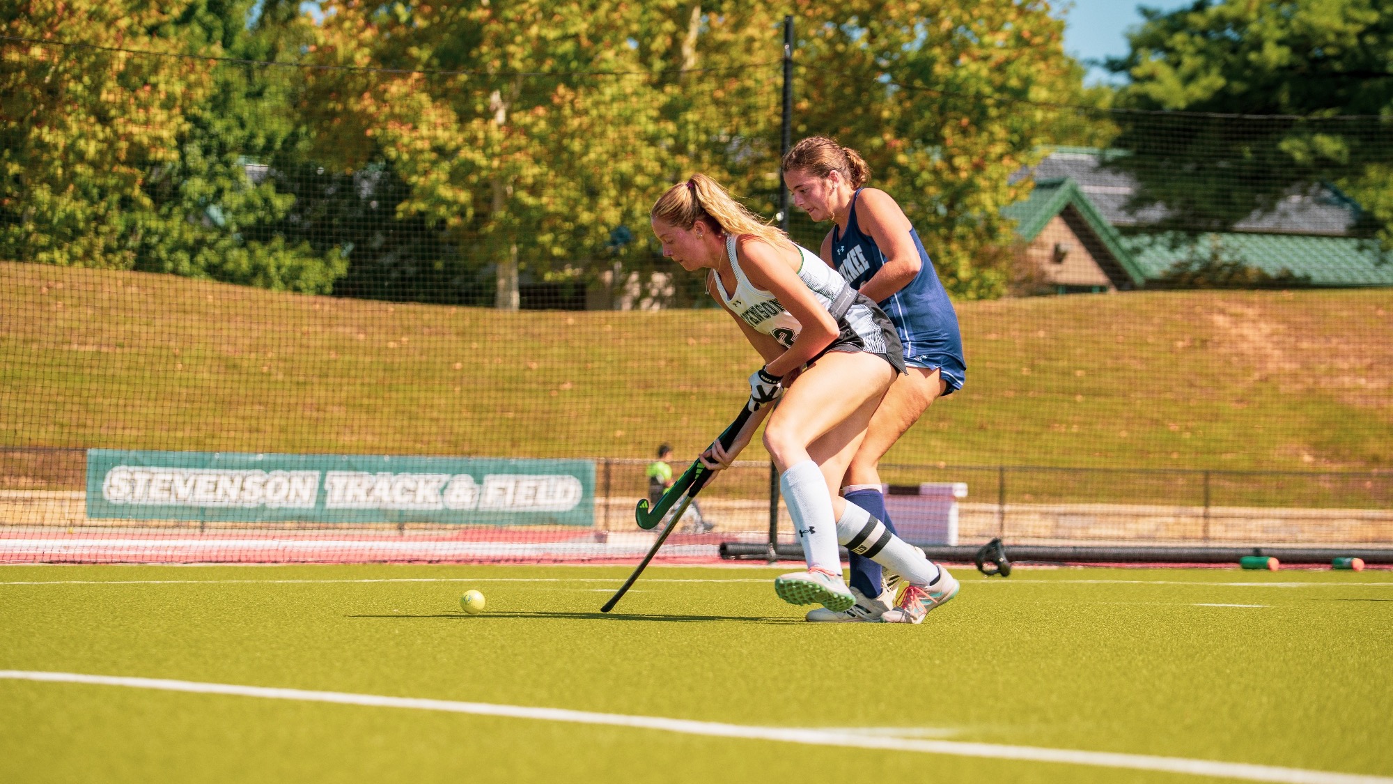 Mertz looking to pass a defender