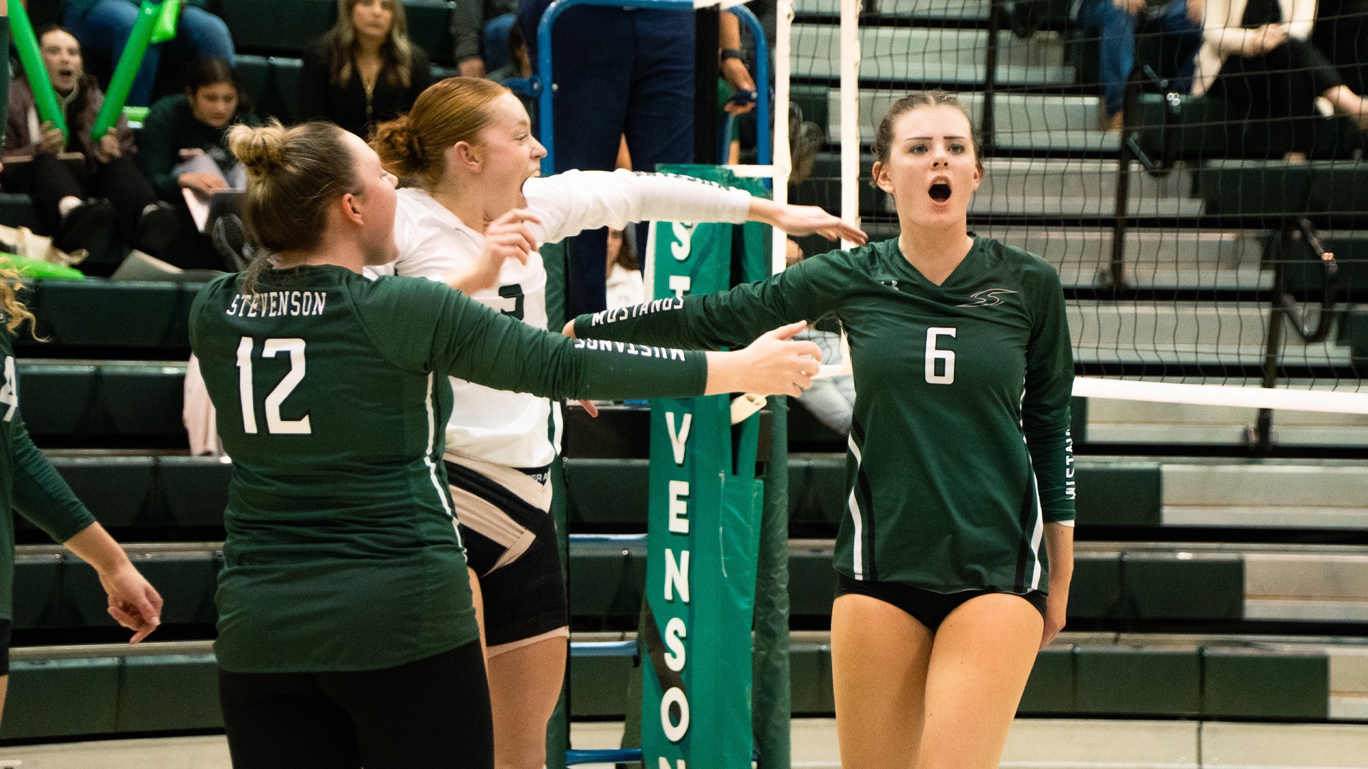 Women's Volleyball celebrating the win over Neumann