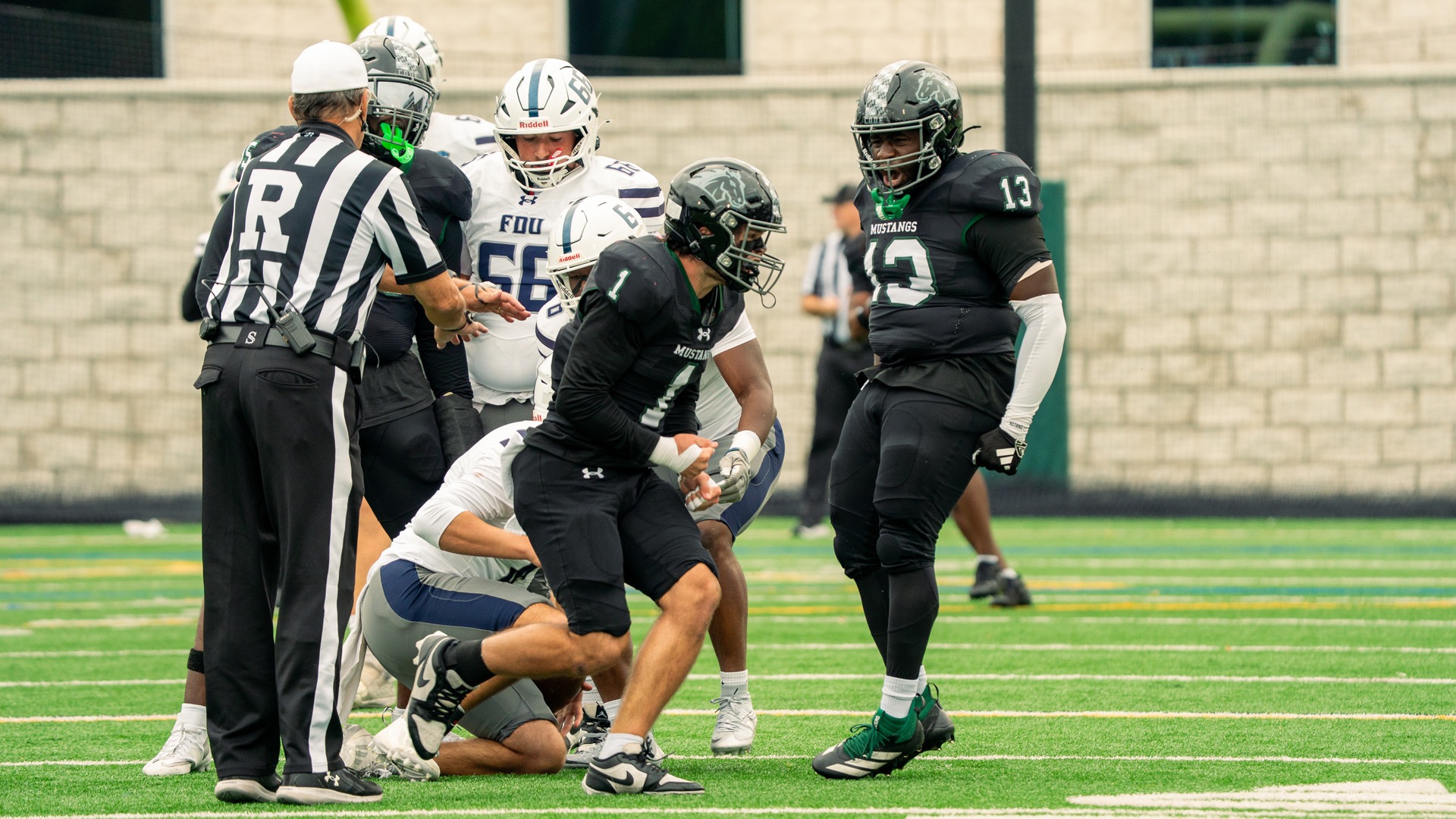 Dail and Alder excited after their sack against the FDU-Florham quarterback