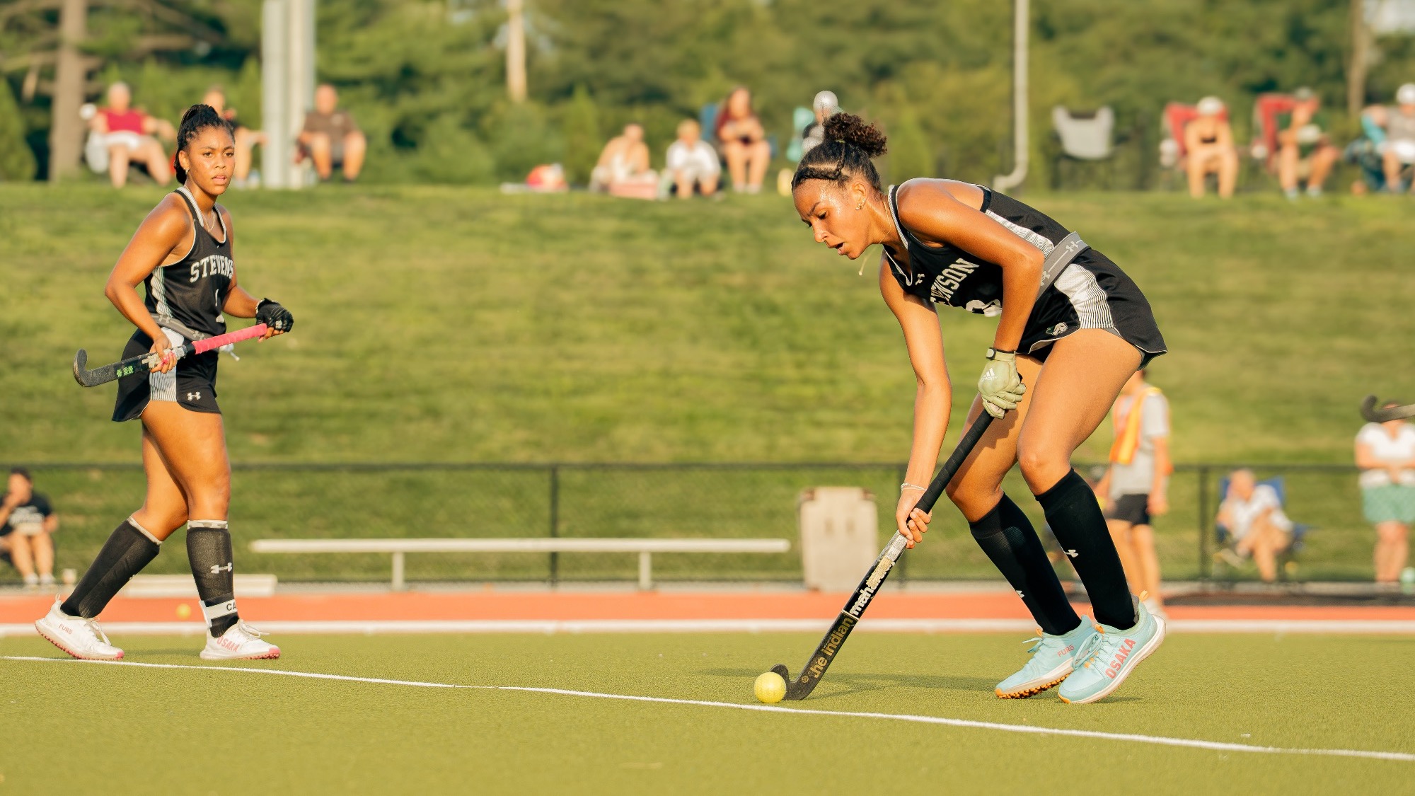 Druckemiller dribbling the ball in Field Hockey