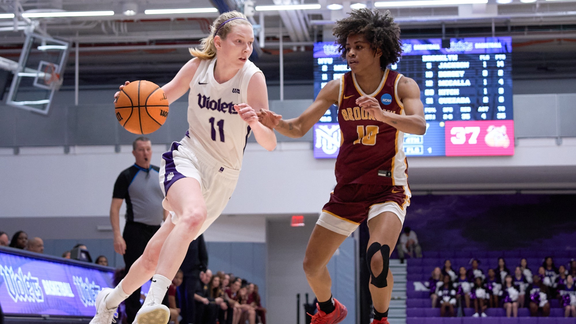 Caroline Peper drives to the basket vs. Brooklyn College
