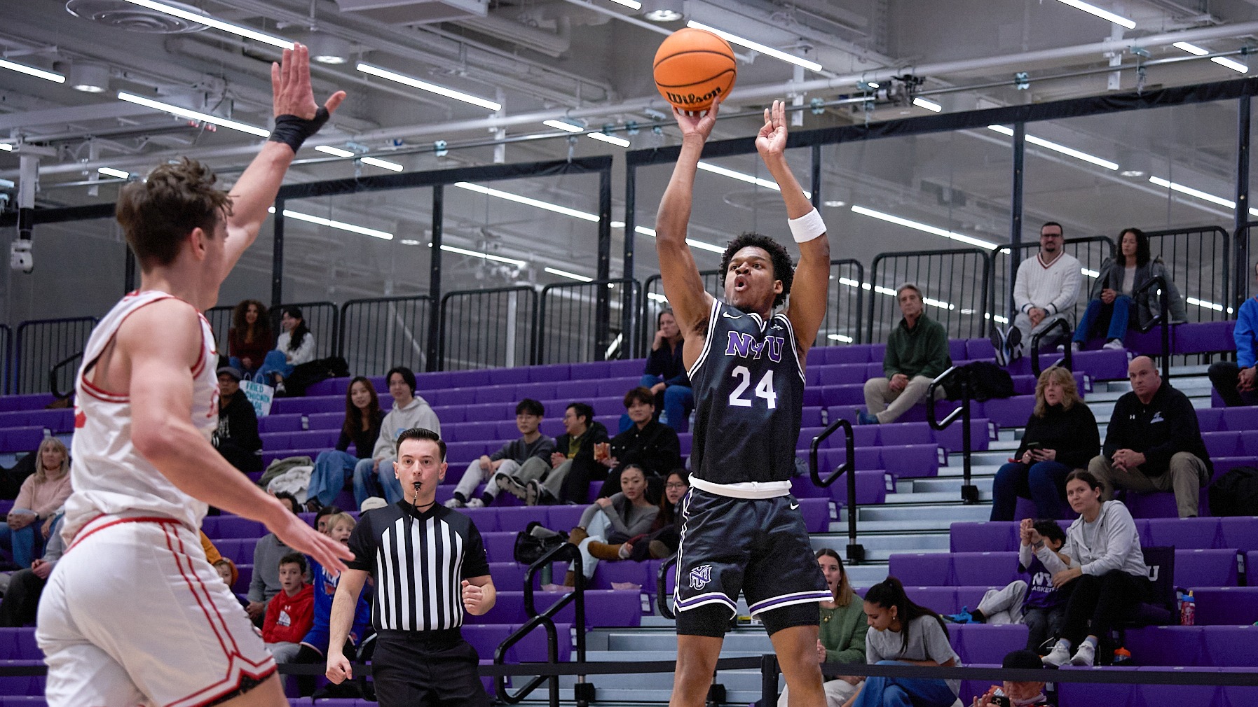Bryan Moussako shoots a three-pointer vs. Lancaster Bible College