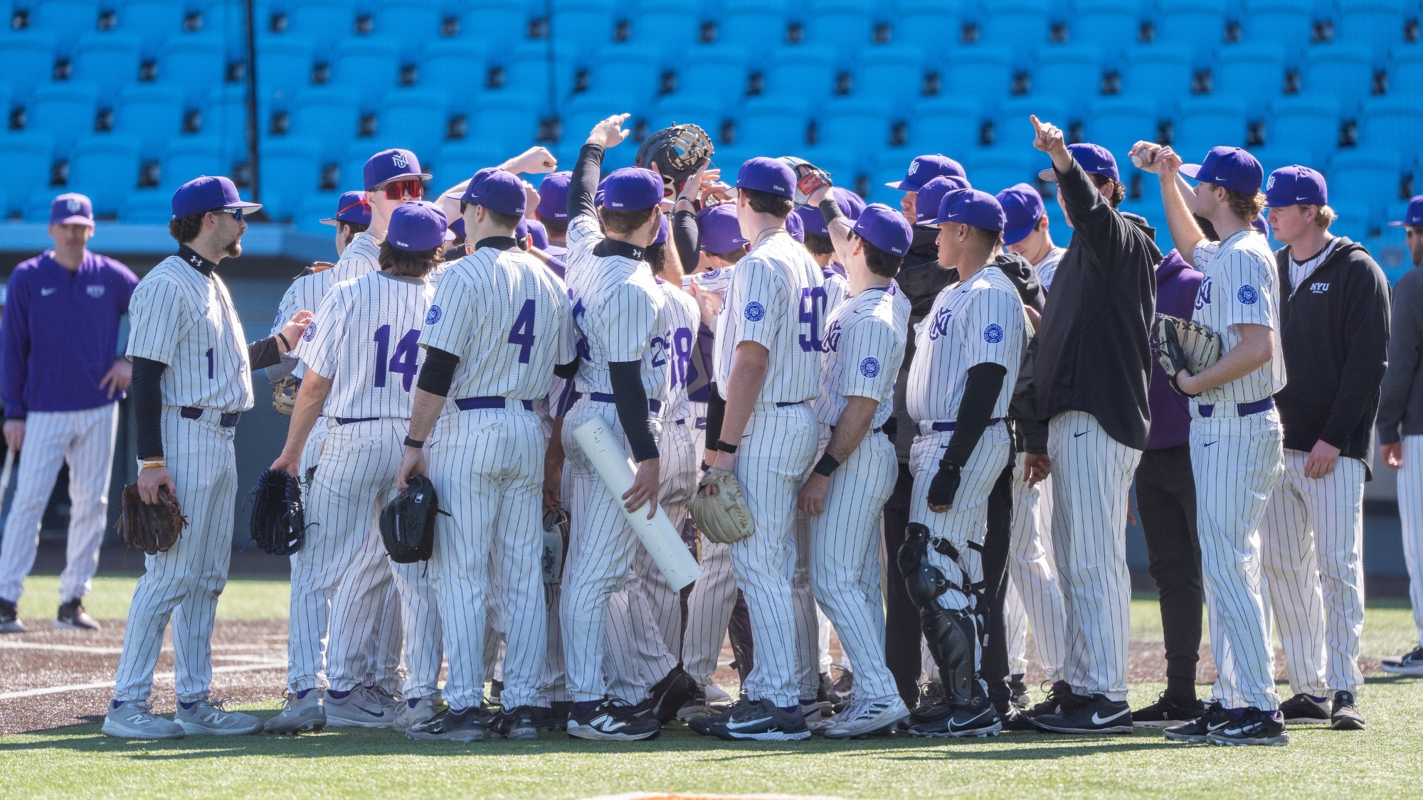 Baseball team huddles