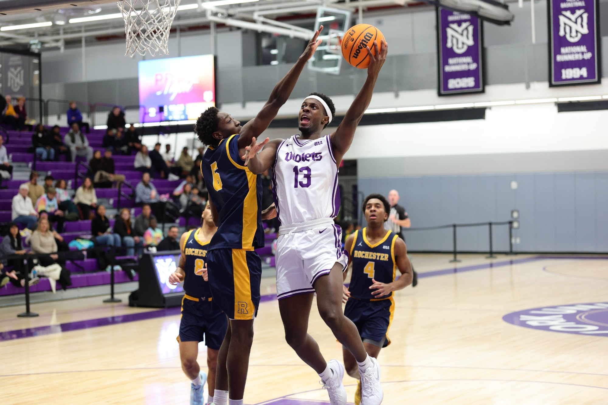 Darius Gakwasi drives to the basket vs. Rochester