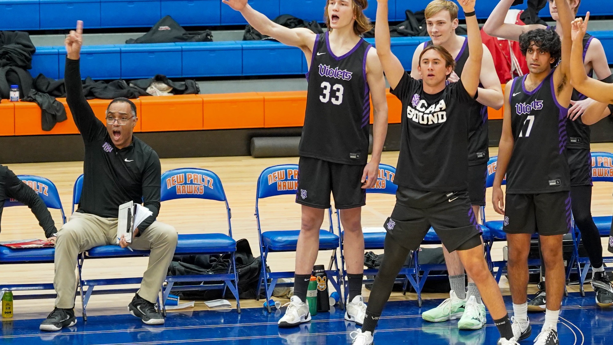 Assistant Coach Patrick Dietz celebrates with his team on the sidelines against SUNY New Paltz during the 2026 UVC Championship