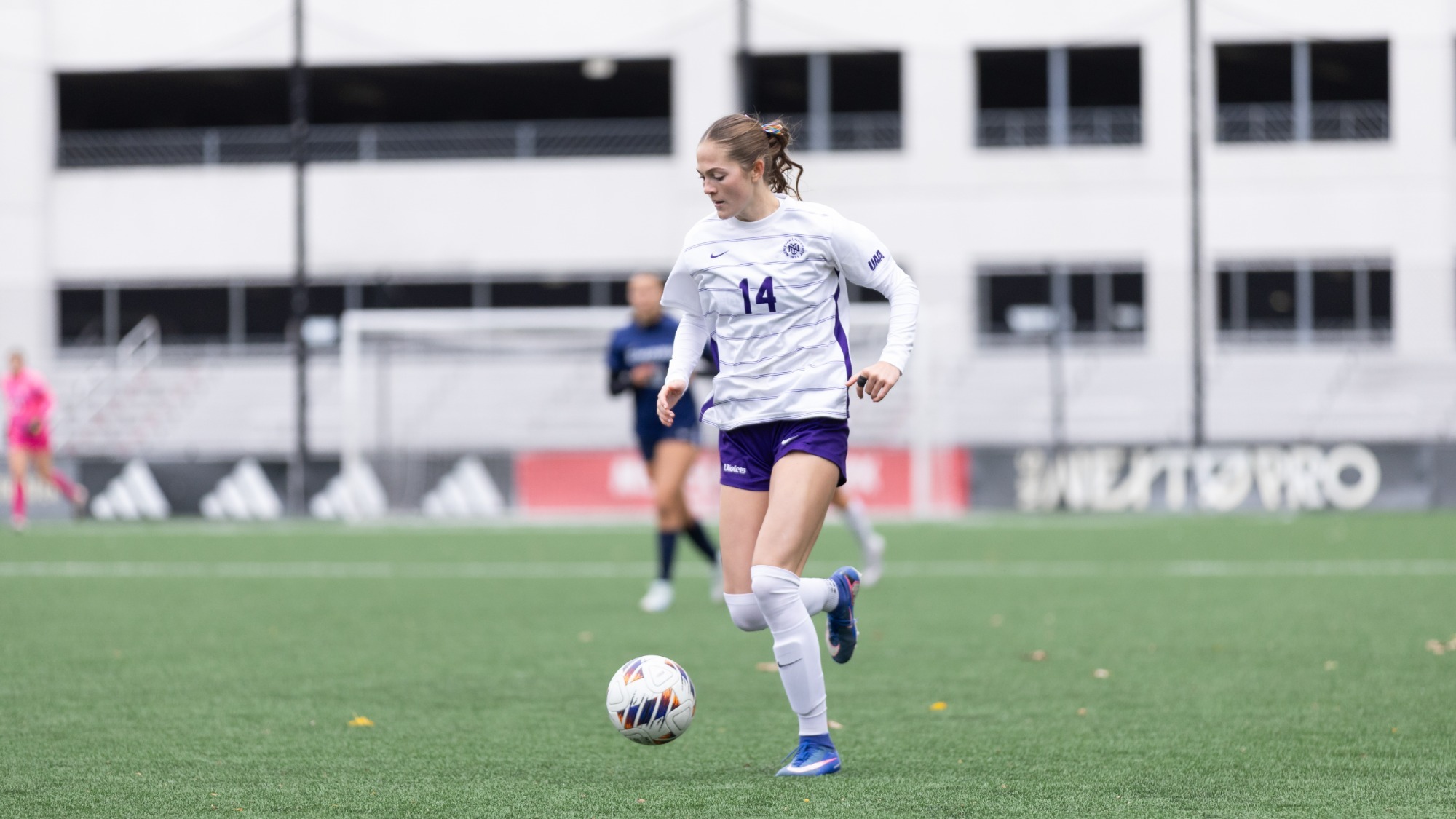 Leah Berg runs with the ball at her feet vs. Emory University on Oct. 17