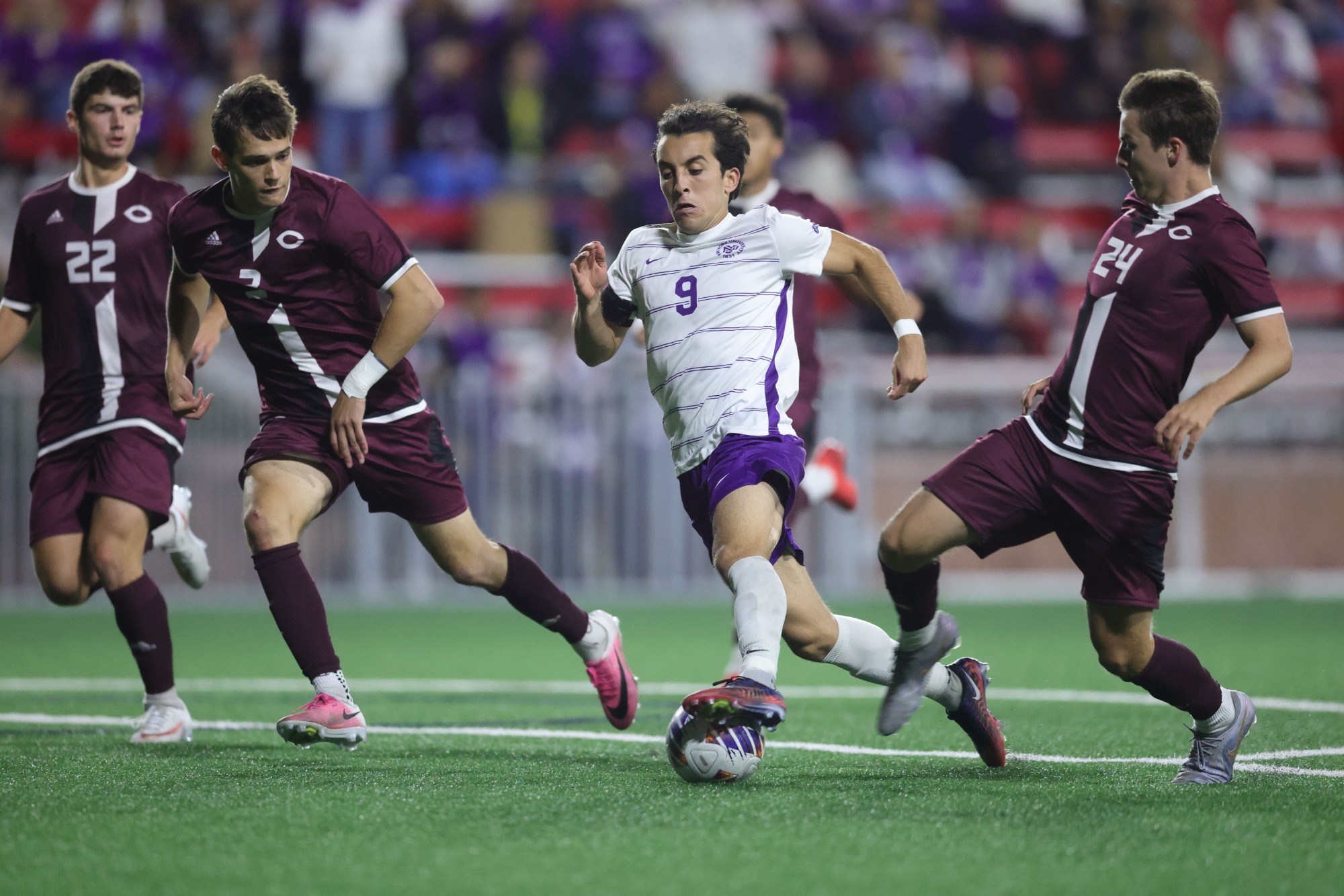 Keyon Namdar fights for the ball with an opposing defender