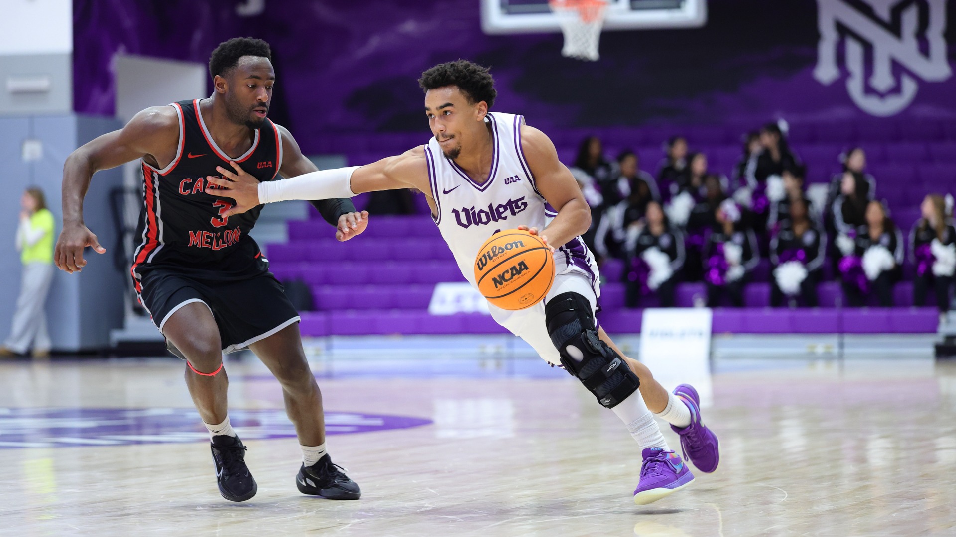 Carnegie Johnson drives to the basket vs. Carnegie Mellon