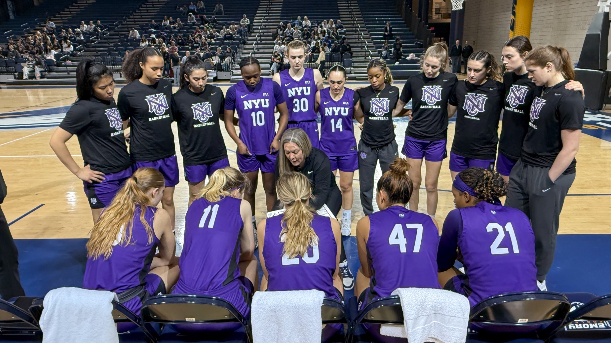 Women's basketball huddles vs. Emory