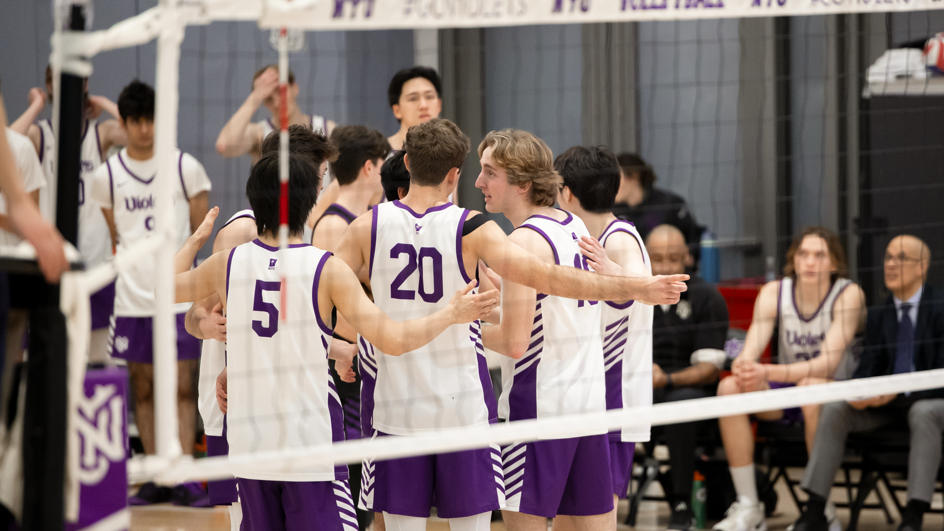 Men's Volleyball huddles vs. Springfield