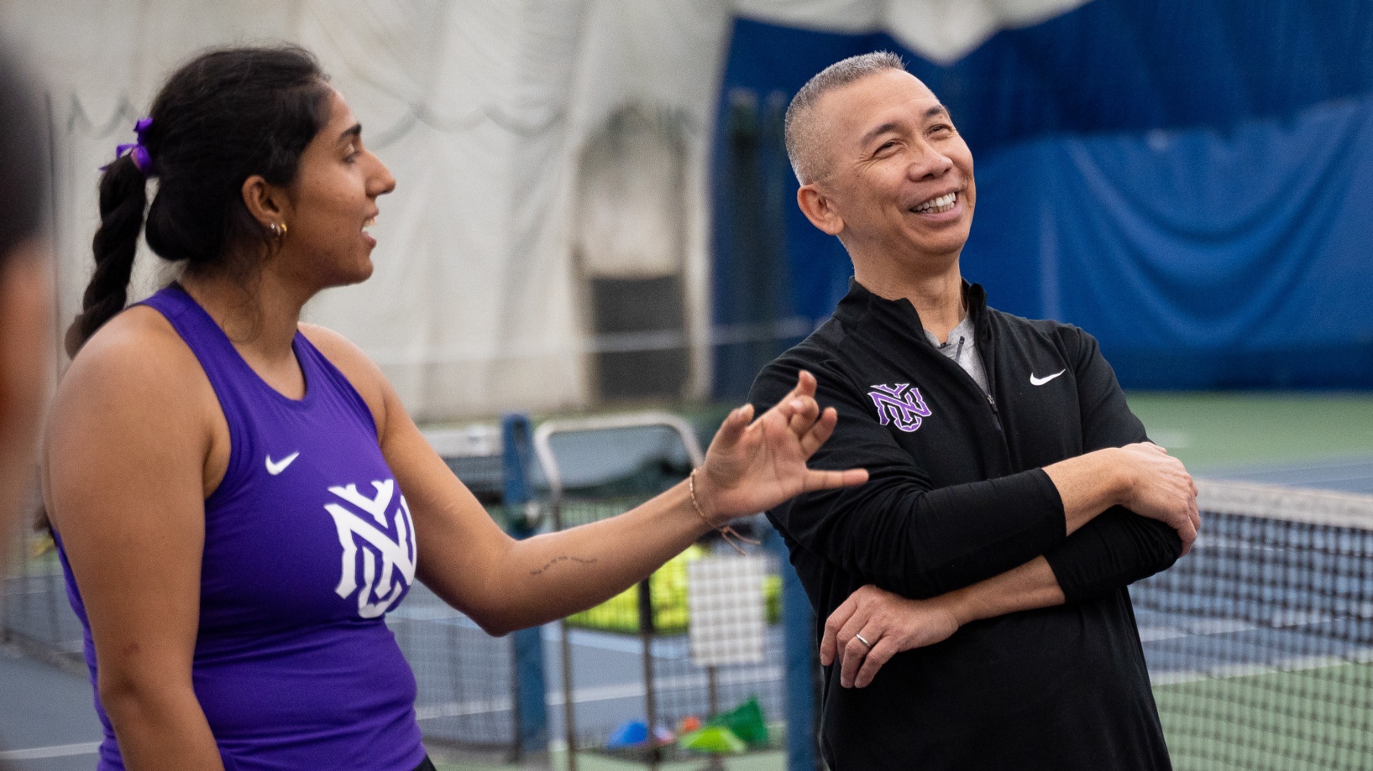 Head coach Horace Choy smiles with team