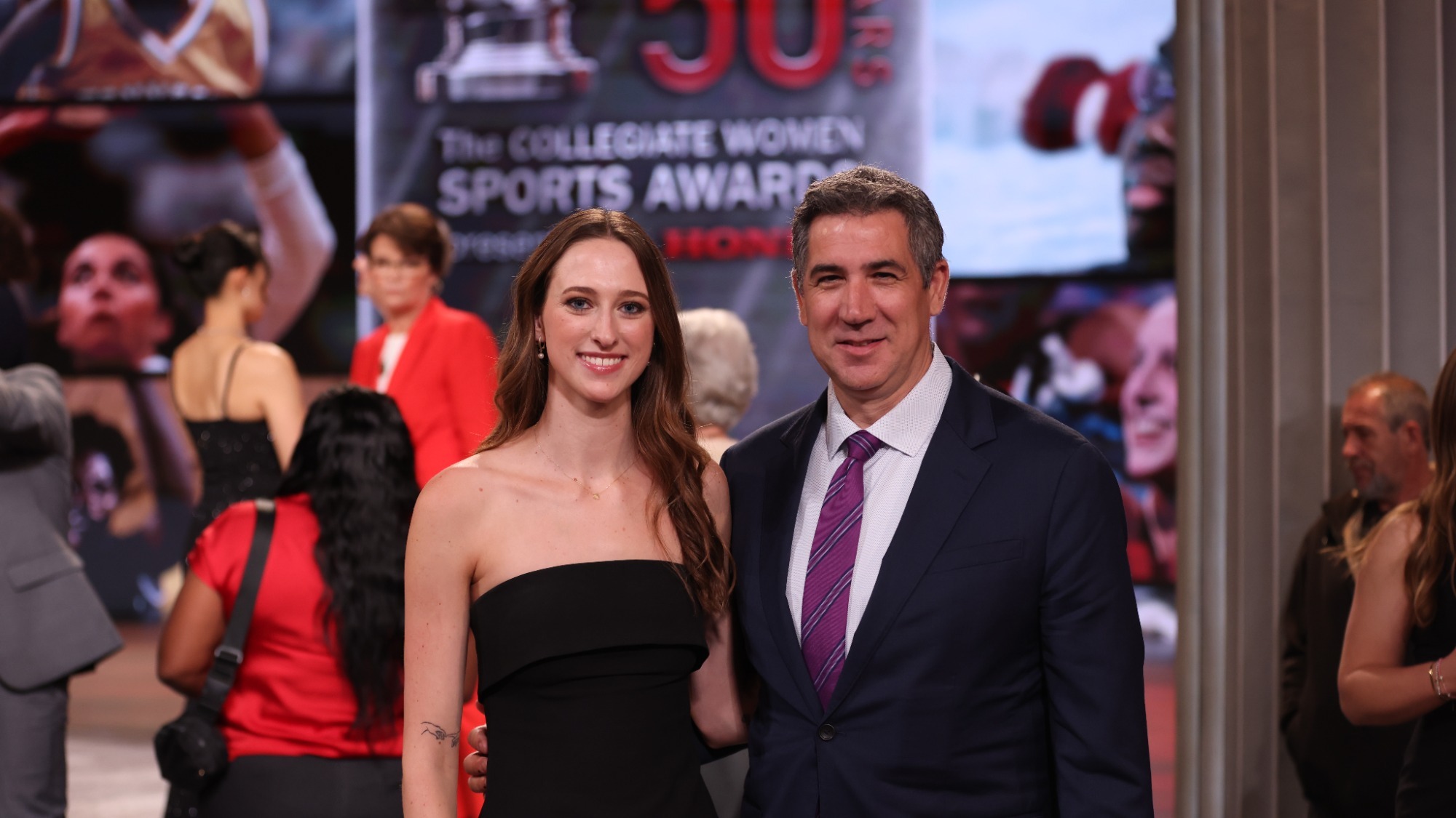 Kaley McIntyre poses with Head Coach Trevor Miele at the 2026 Collegiate Womens Sports Awards broadcast