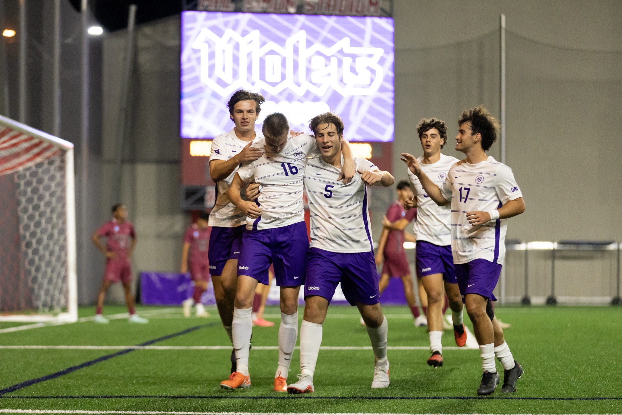 Tim Brdaric caps off the Violets' lead in Tuesday night's victory over Vassar.