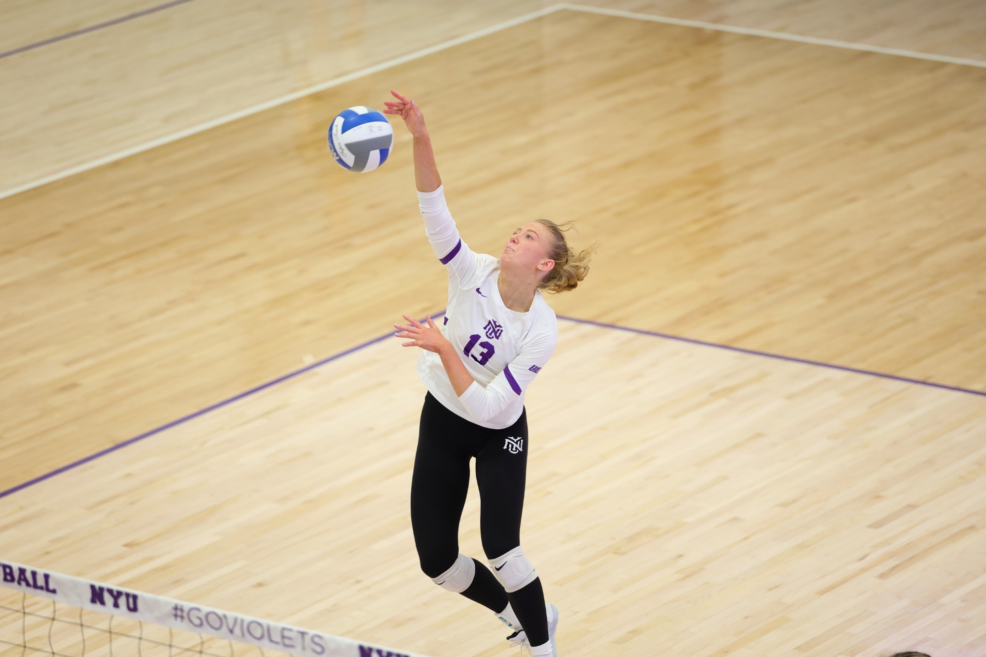 Grace Nelson delivers the match-clinching kill for the Violets.