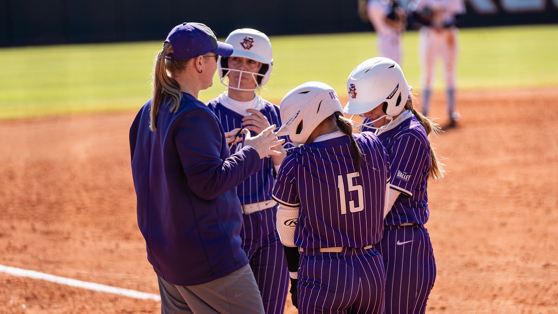 Softball huddle - vs. Maine