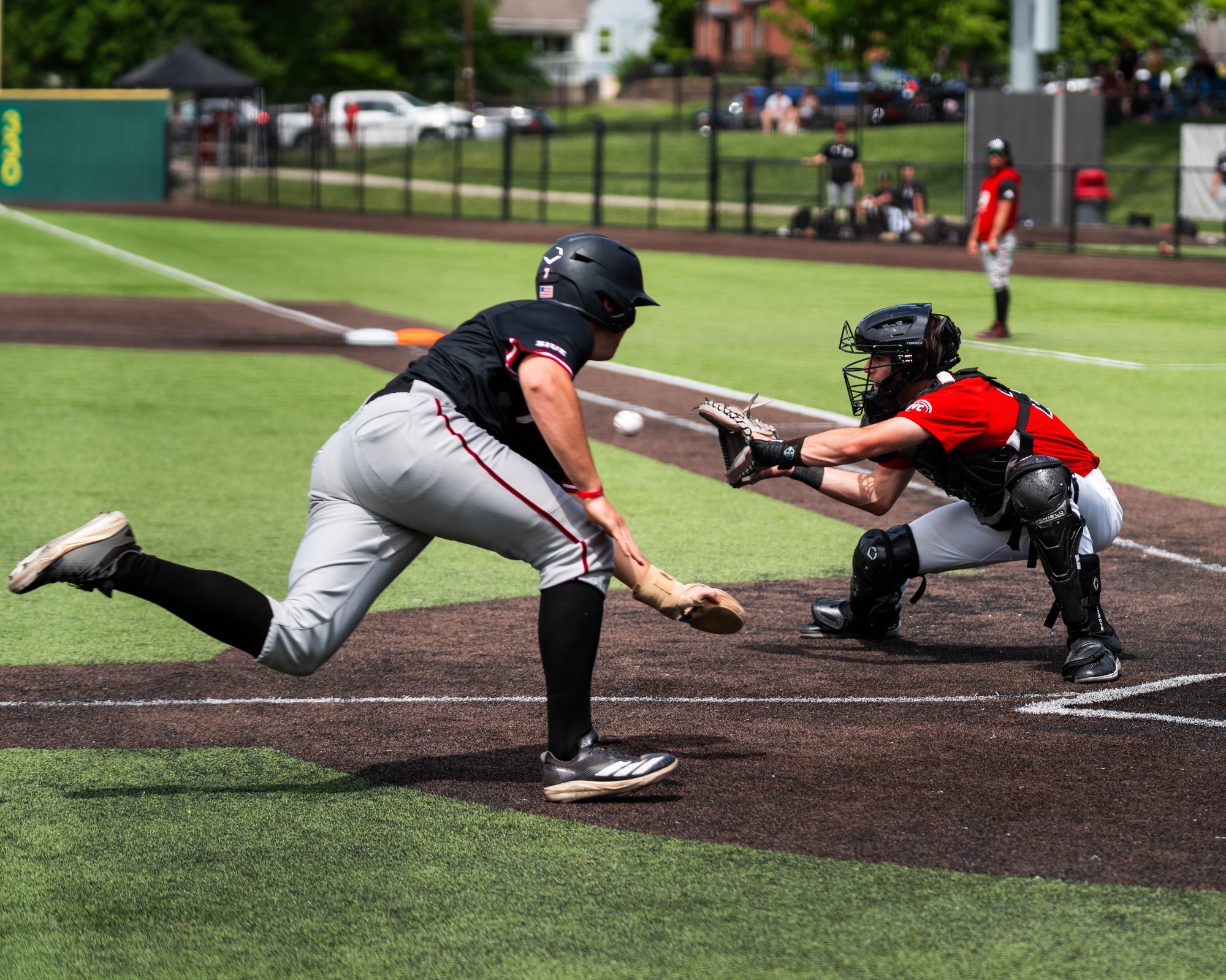 Tank Sims receives the ball and attempts to tag out a runner